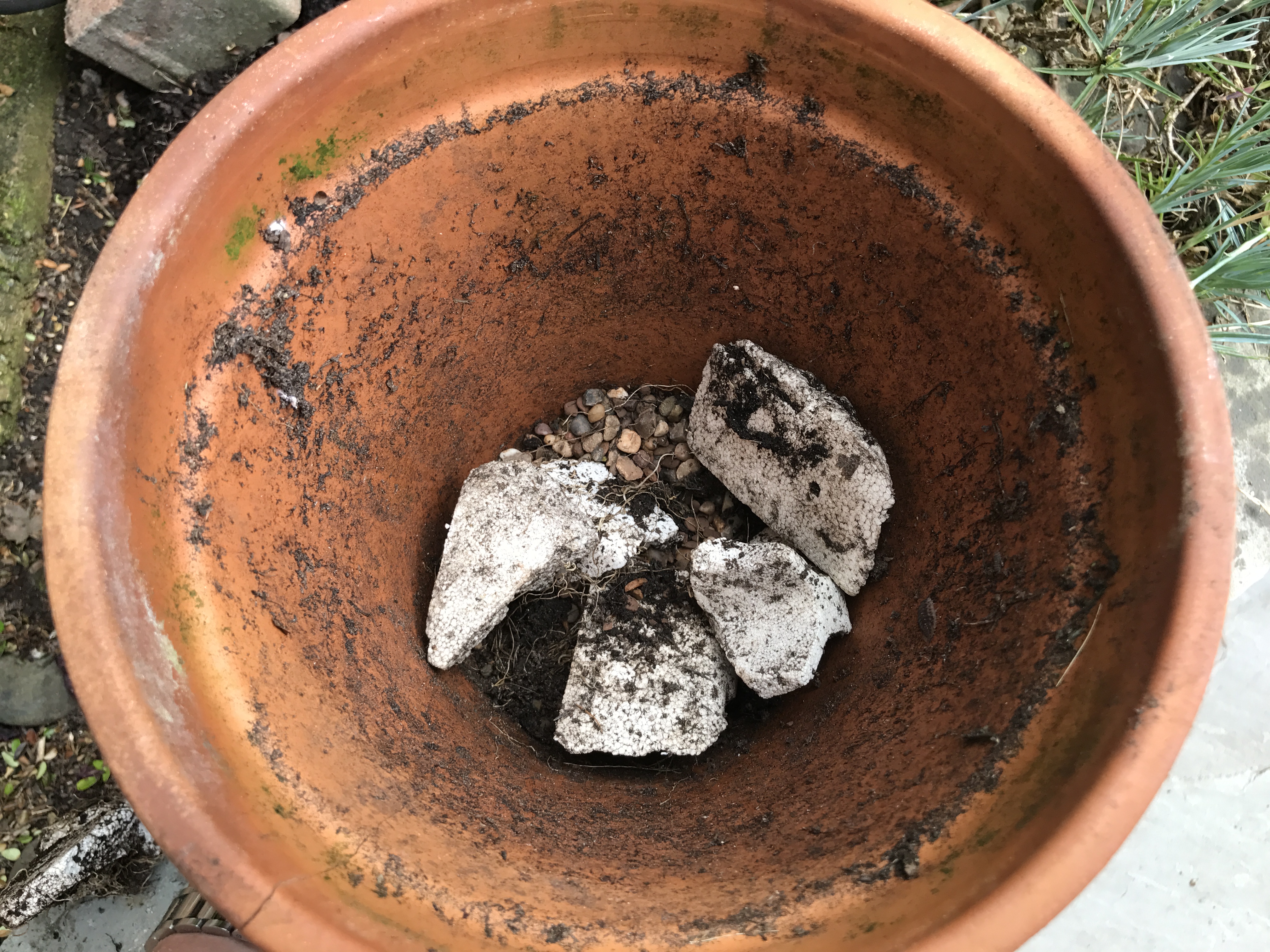 Add drainage material to pots (Hannah Stephenson/PA)