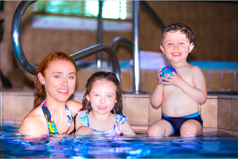 Una Healy and her children in a pool
