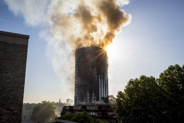 Smoke billowing from the 24-storey Grenfell Tower in west London (Rick Findler/PA)