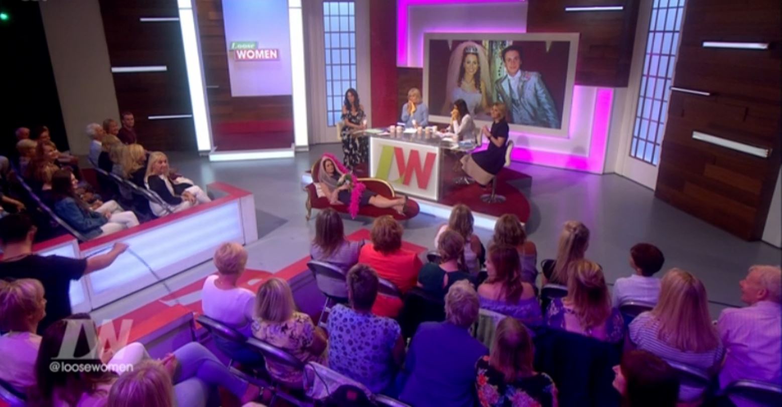  Amy posed on a chaise longue in a pink veil in front of the TV audience