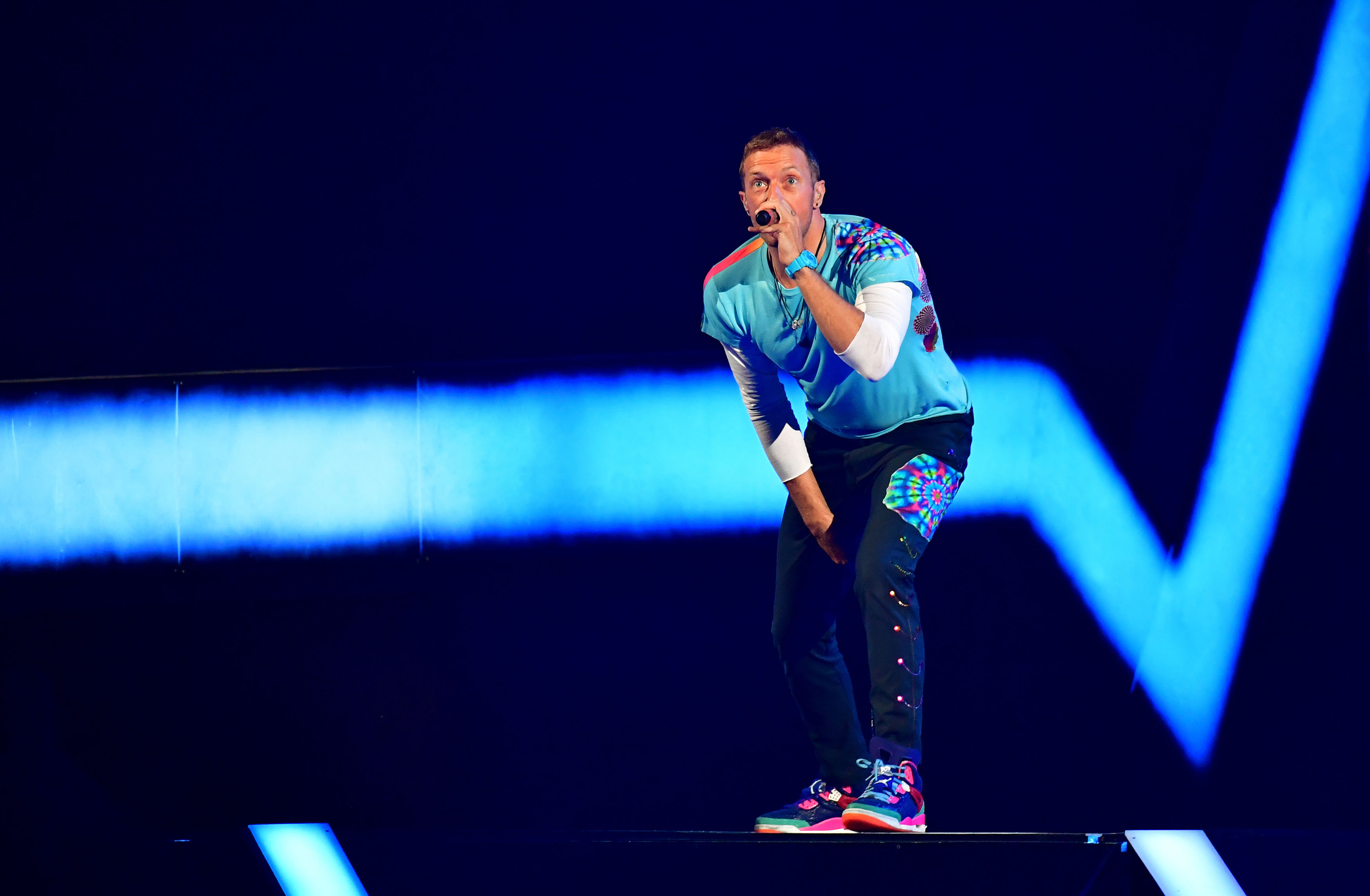 Coldplay's Chris Martin performing at the Brit Awards