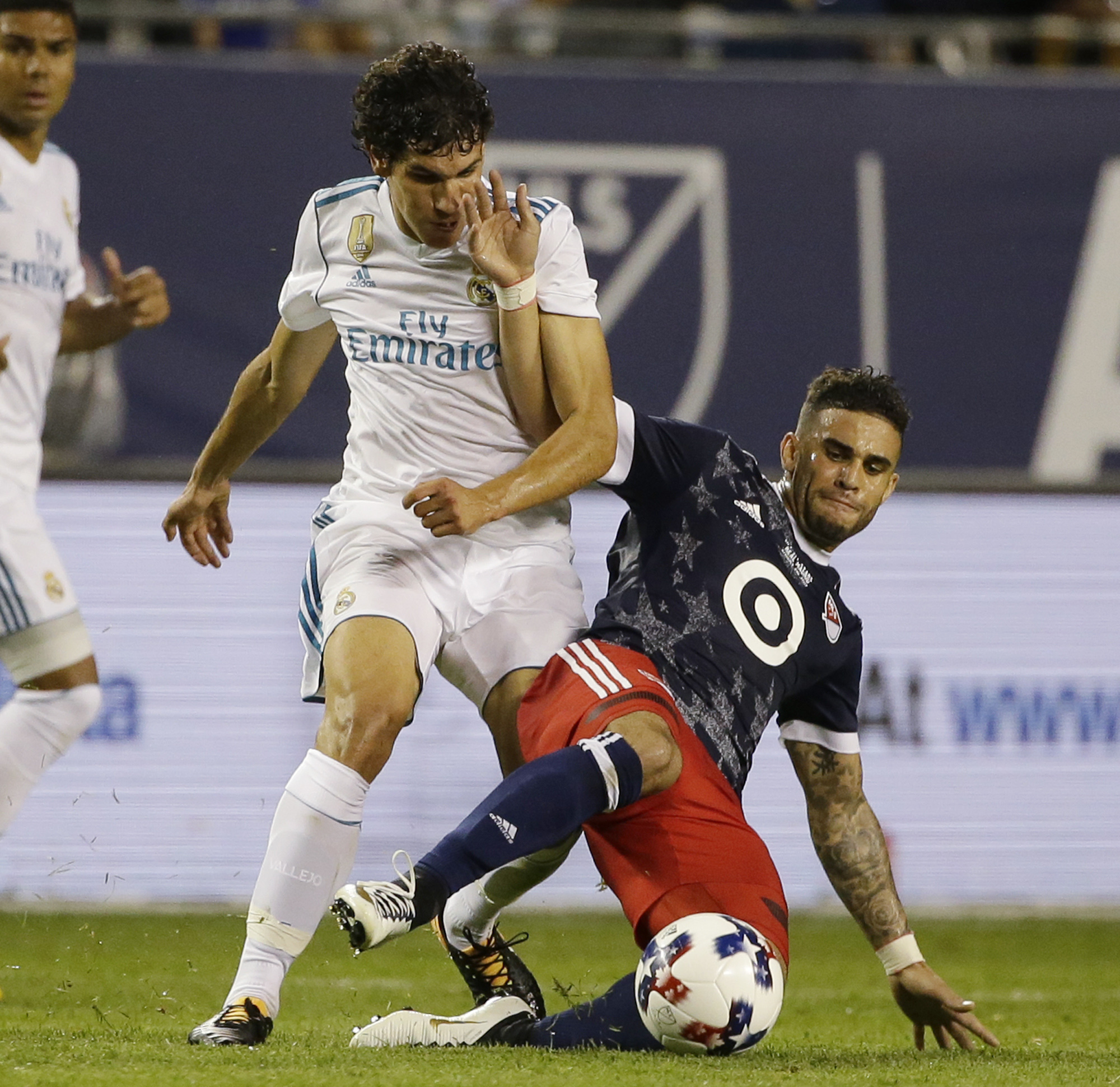 MLS All-Star footballer Dom Dwyer tackles a Real Madrid player