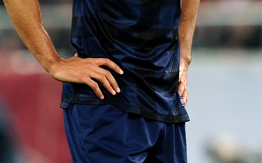 Footballer with hands on hips