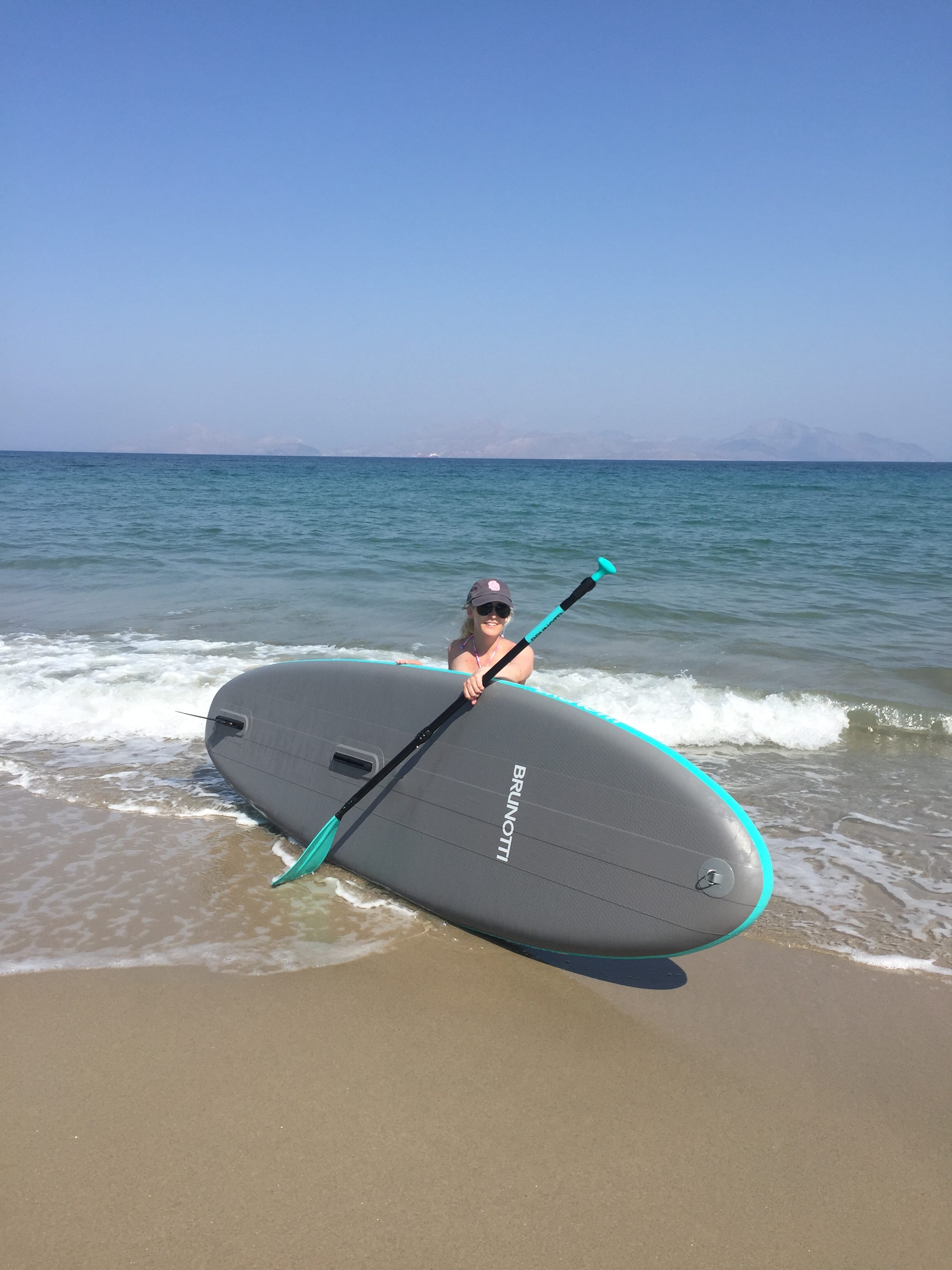 Kerri trying stand-up paddle boarding
