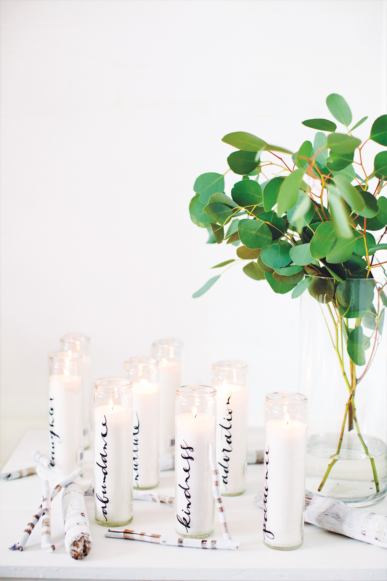 Jar candles made special with meaningful words (you could feature each guest's name) written using a glass pen on their sides to make a lovely table centrepiece (Decorate For A Party/Jacqui Small/PA)