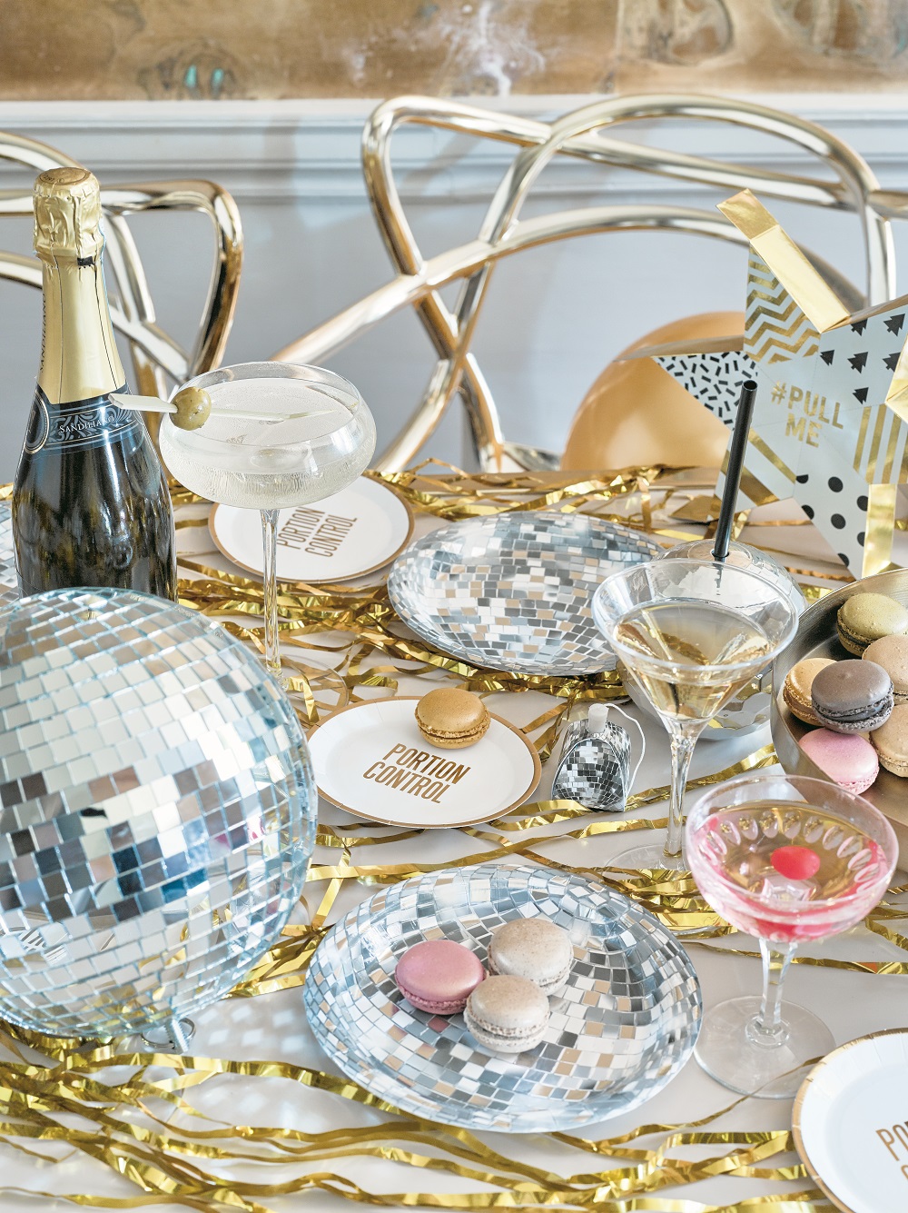 Glitterati disco range paper plates, 12 pack, £5.49; disco ball, £13.99; party poppers, pack of 8, £6.99, Talking Tables (Talking Tables/PA)