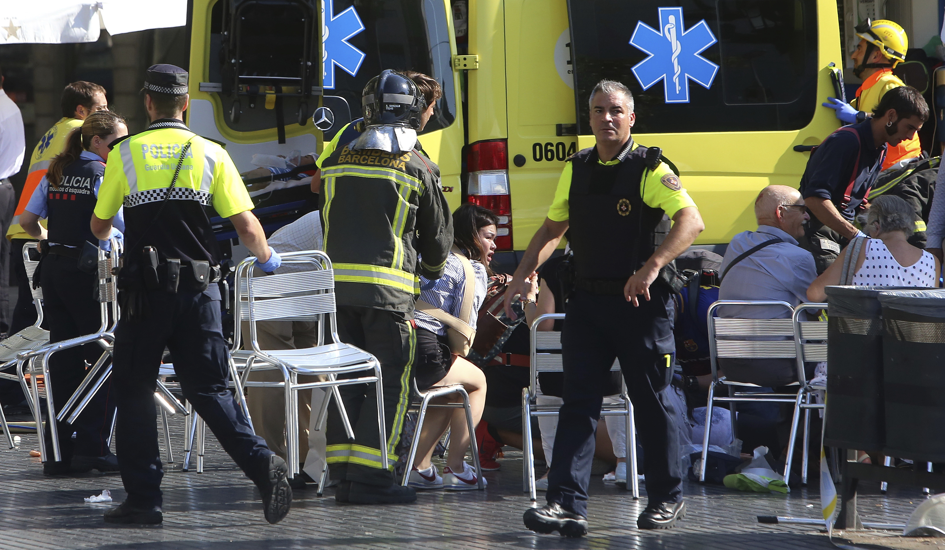 Injured people are tended to by emergency services