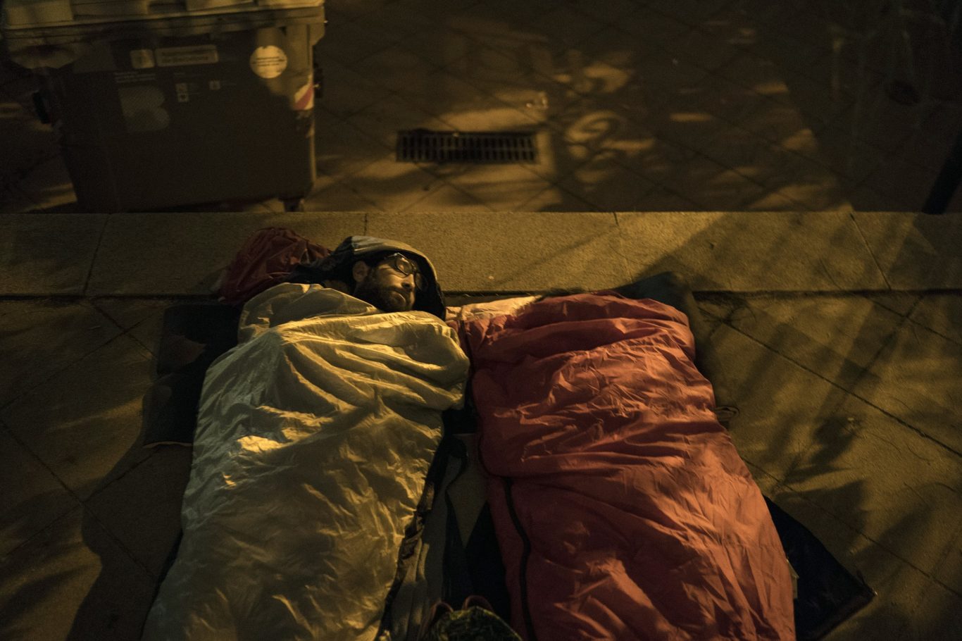 Pro-referendum supporters sleep at a school listed to be a polling station by the Catalan government (Felipe Dana/AP)