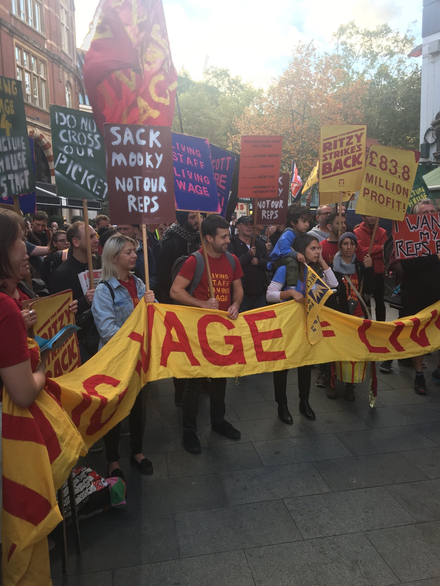 Protesters waving banners at the London event.