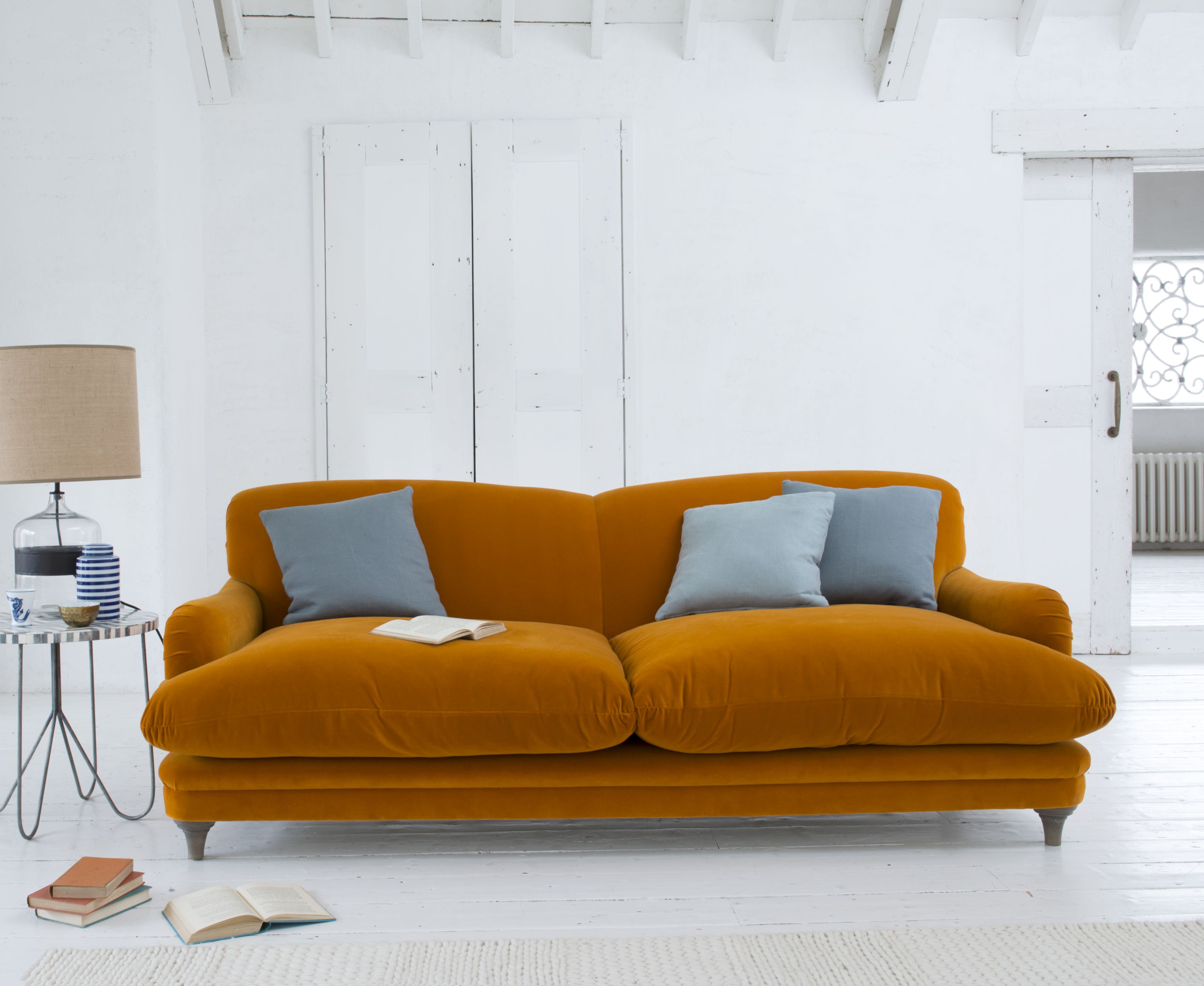 Pudding sofa, in burnt orange plush velvet, from £1,195, Loaf (Loaf/PA)