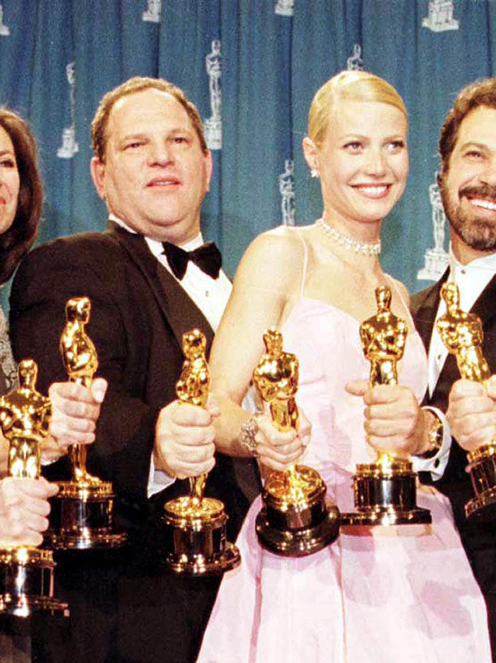 Harvey Weinstein and Gwyneth Paltrow with Oscars won for Shakespeare In Love in 1999 (PA)