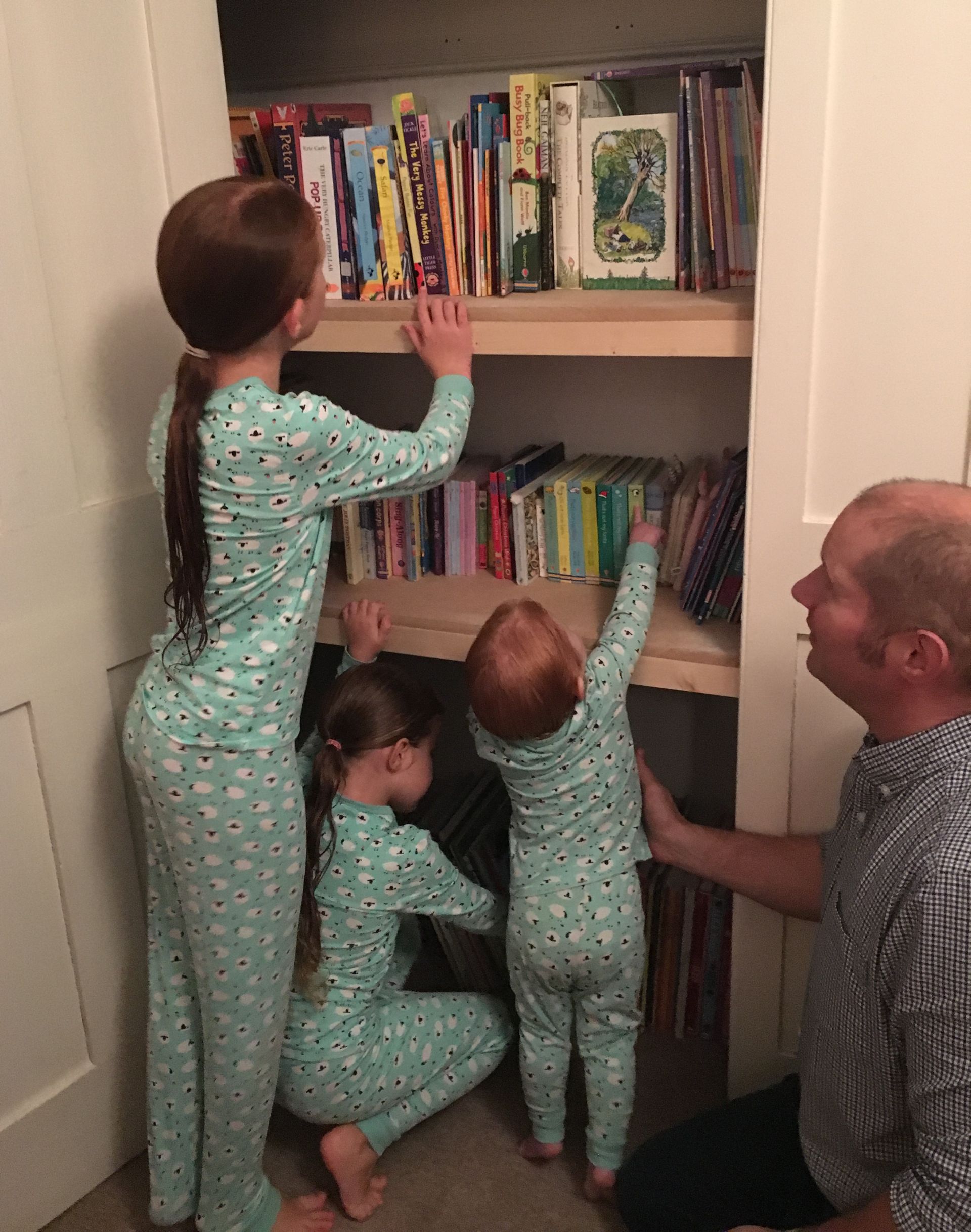 Richard Burr's children are choosing their bedtime stories from his bookshelves (Richard Burr/PA)