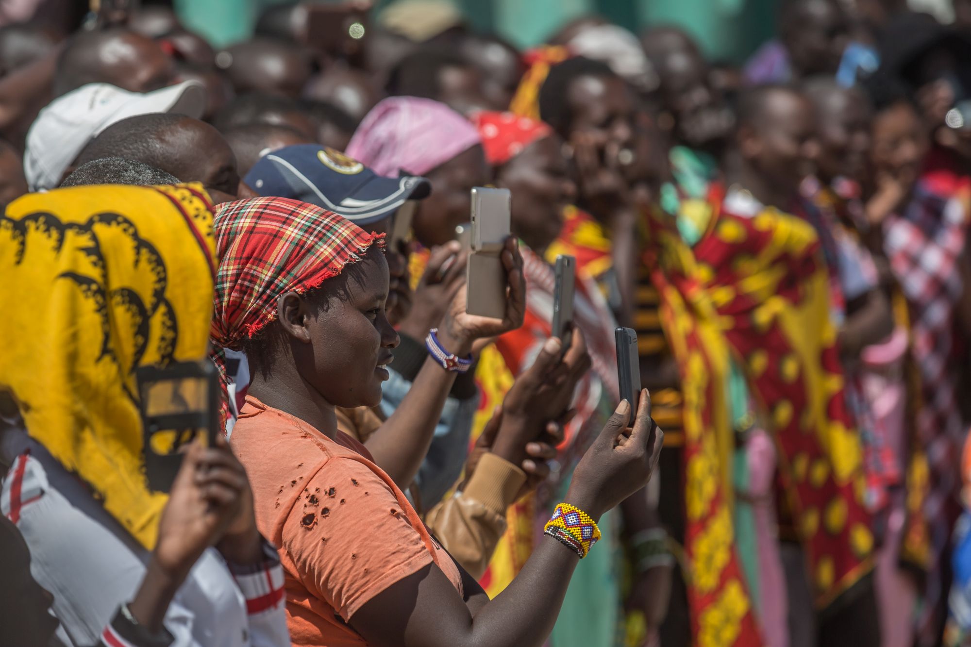 An audience watching a SAFE show on market day in Talek (Paul Goldstein/PA)