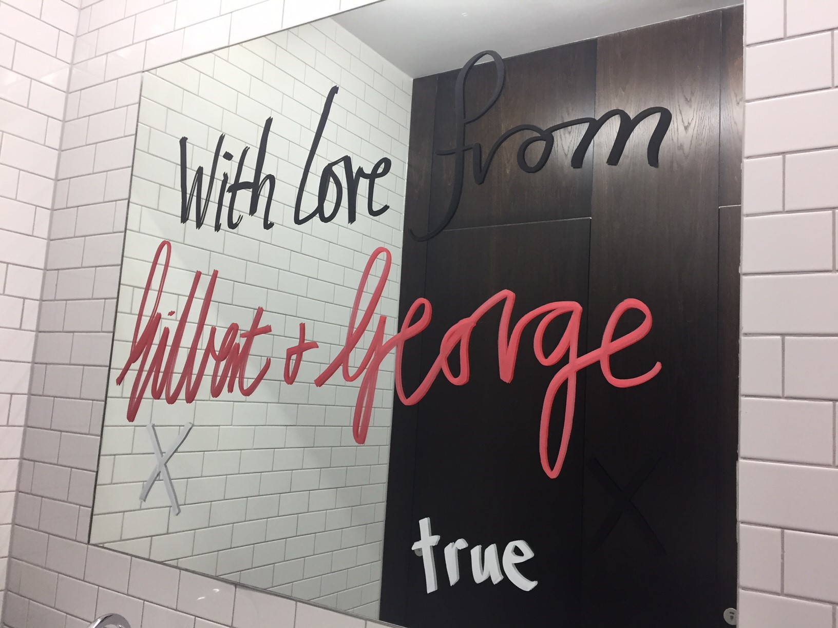 A message from Gilbert and George in the toilets at White Cube (Sherna Noah/PA)