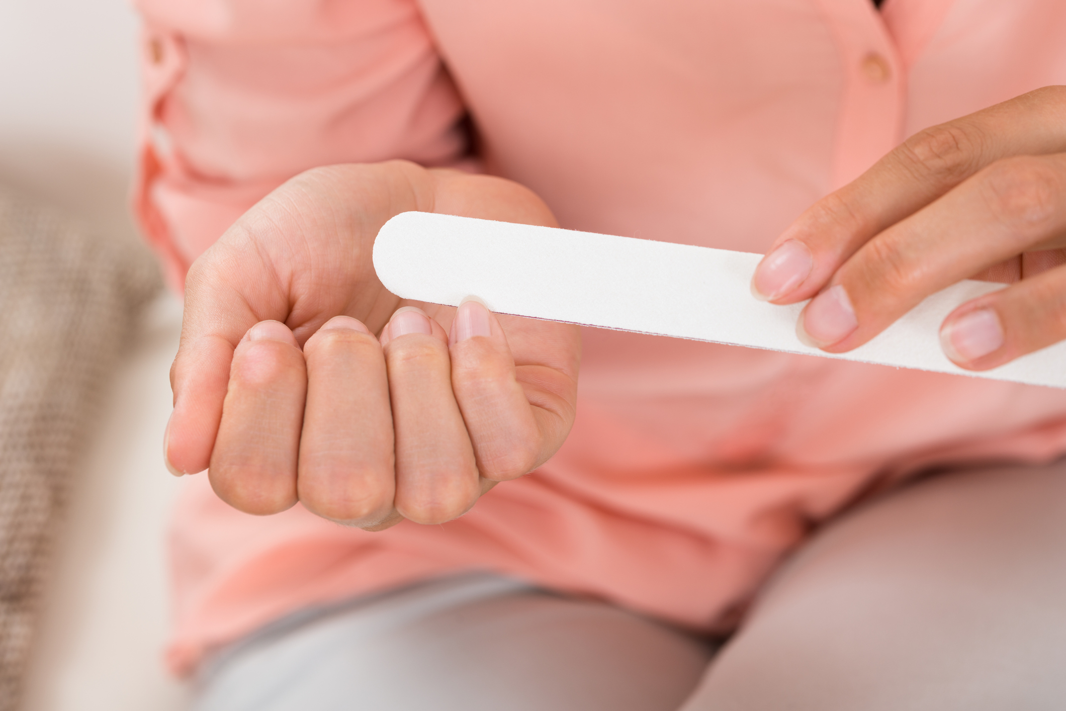 Close-up Photo Of Woman Hands Filing Nails