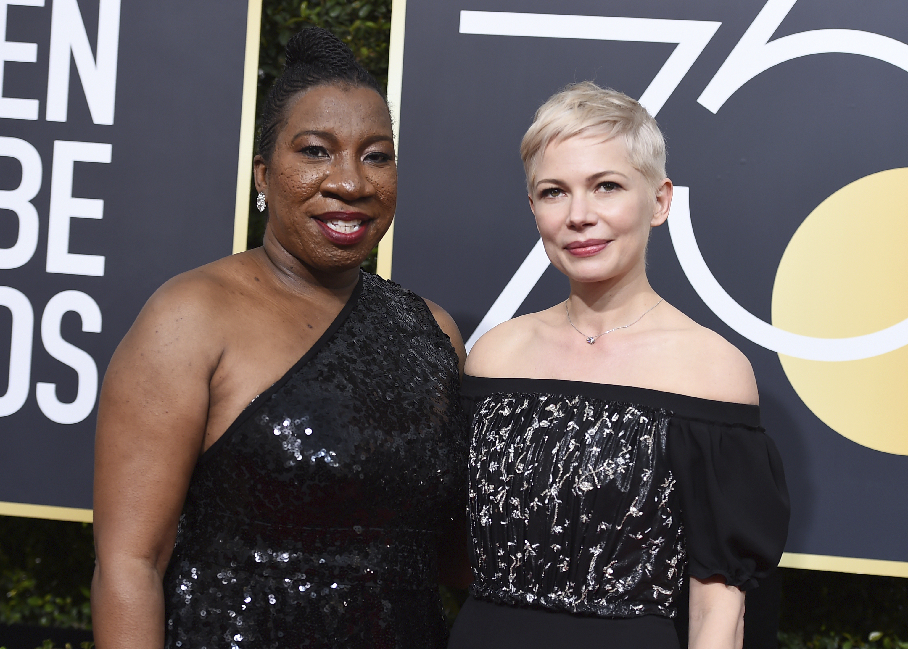 Tarana Burke, left, and Michelle Williams arrive at the 75th annual Golden Globe Awards (Jordan Strauss/Invision/AP)