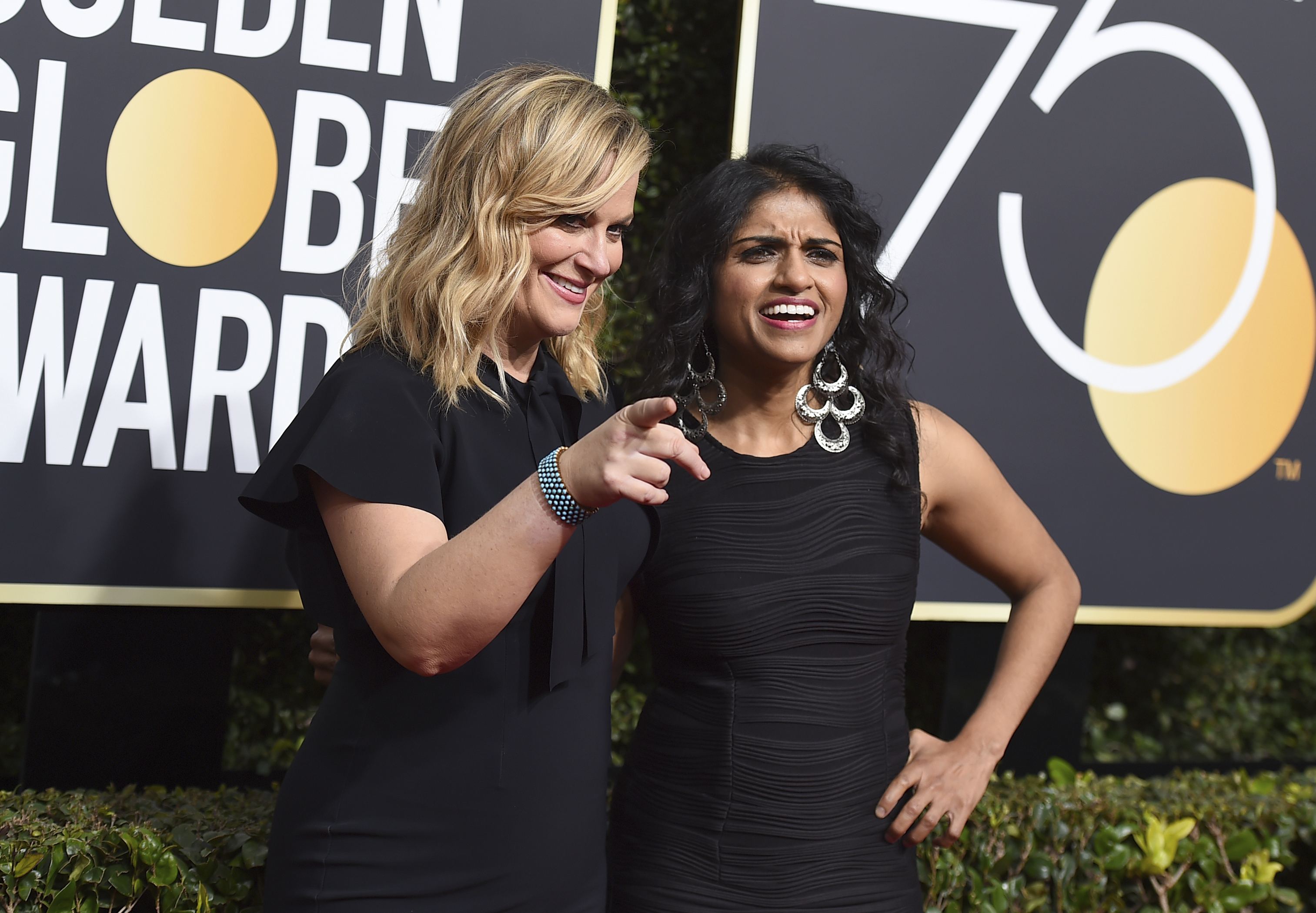 Amy Poehler, left, and Saru Jayaraman (Jordan Strauss/Invision/AP)