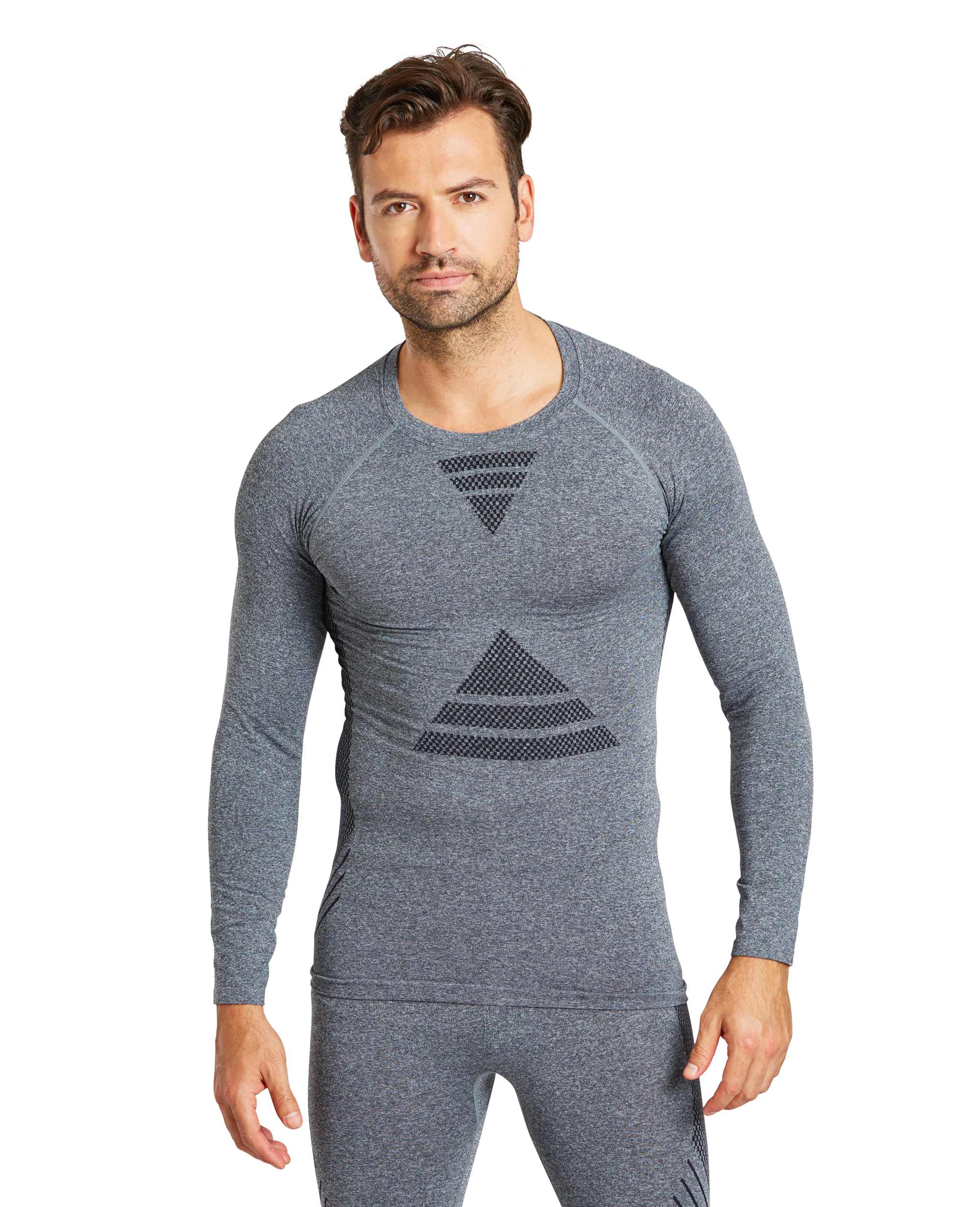 model wearing Zakti Men's Uninterrupted Seamless Base Layer Top Dark Grey and Seamless Pants