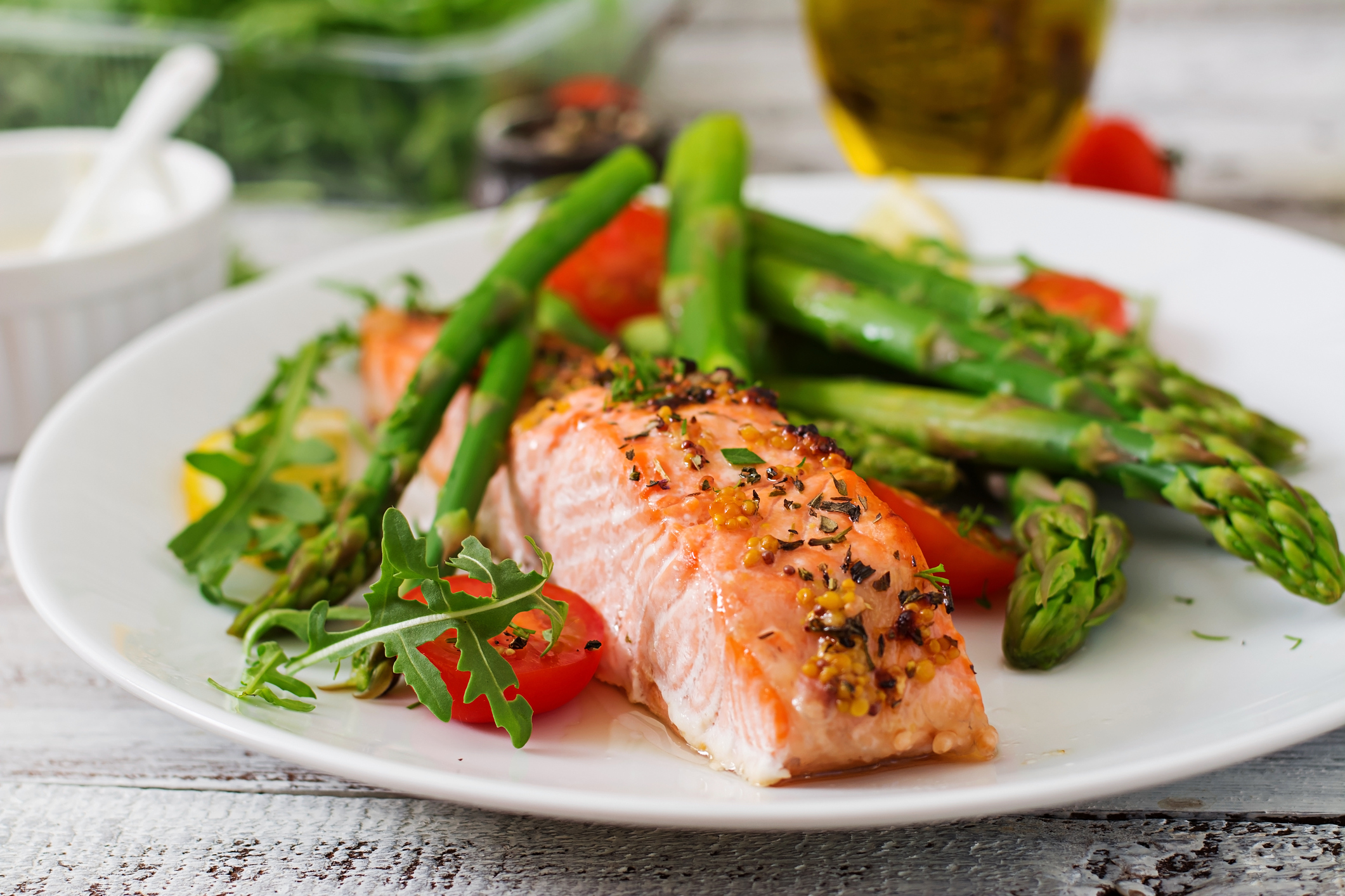 Baked salmon garnished with asparagus and tomatoes with herbs (Thinkstock/PA)
