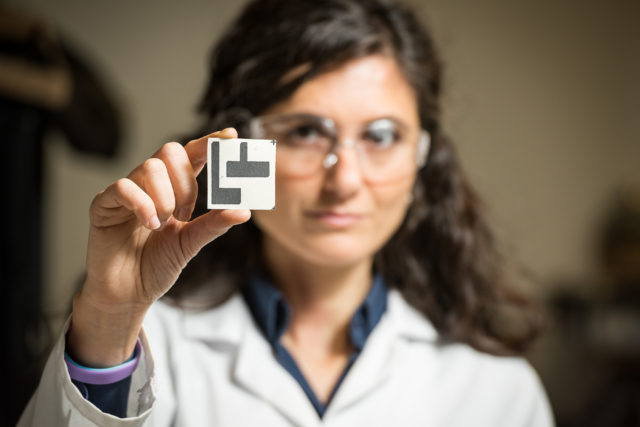 Dr Mirella Di Lorenzo holds the microbial fuel cell (University of Bath/PA)