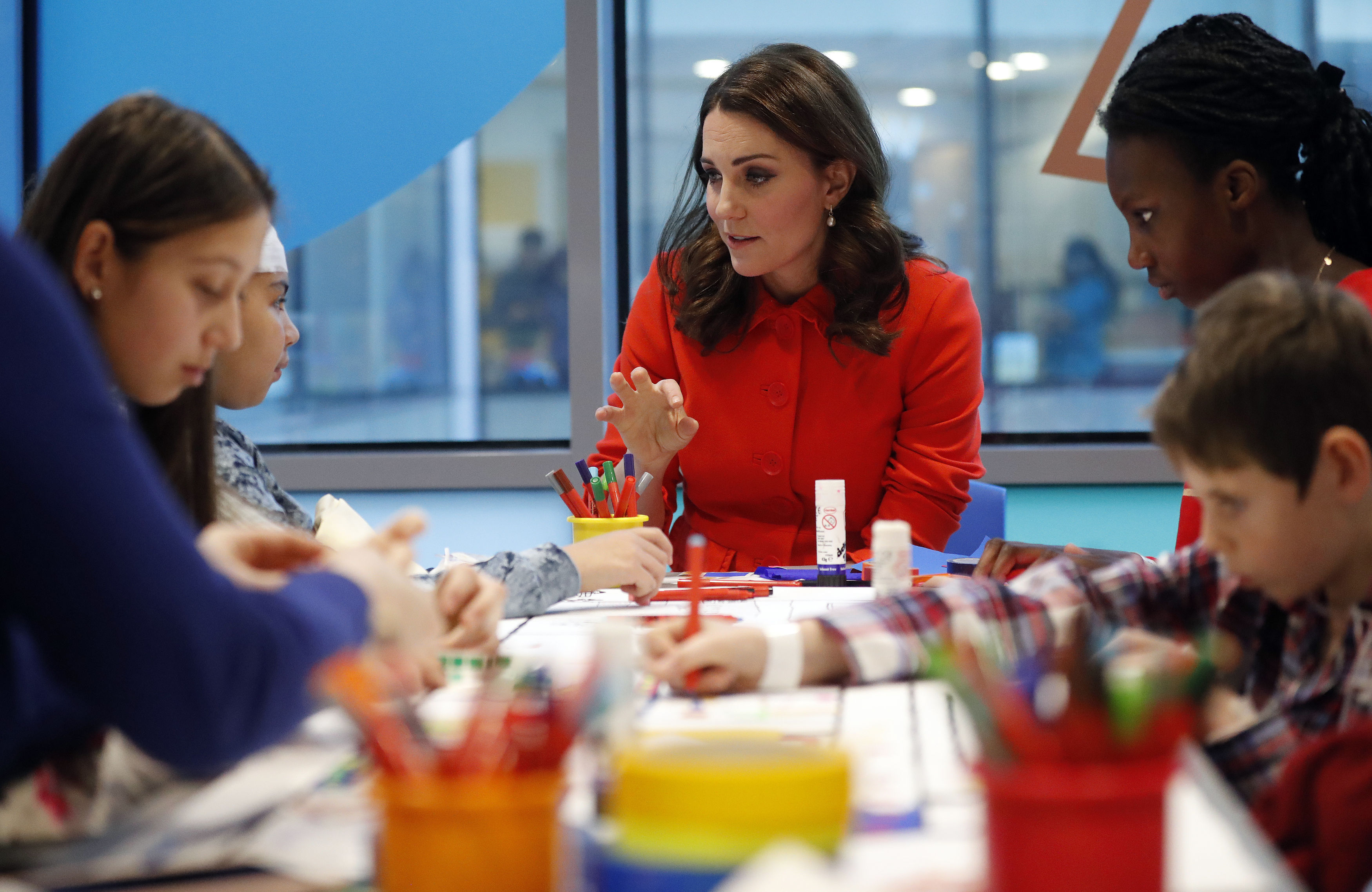 The Duchess of Cambridge speaks to patients as she officially opens the Mittal Children's Medical Centre during a visit to Great Ormond Street Hospital
