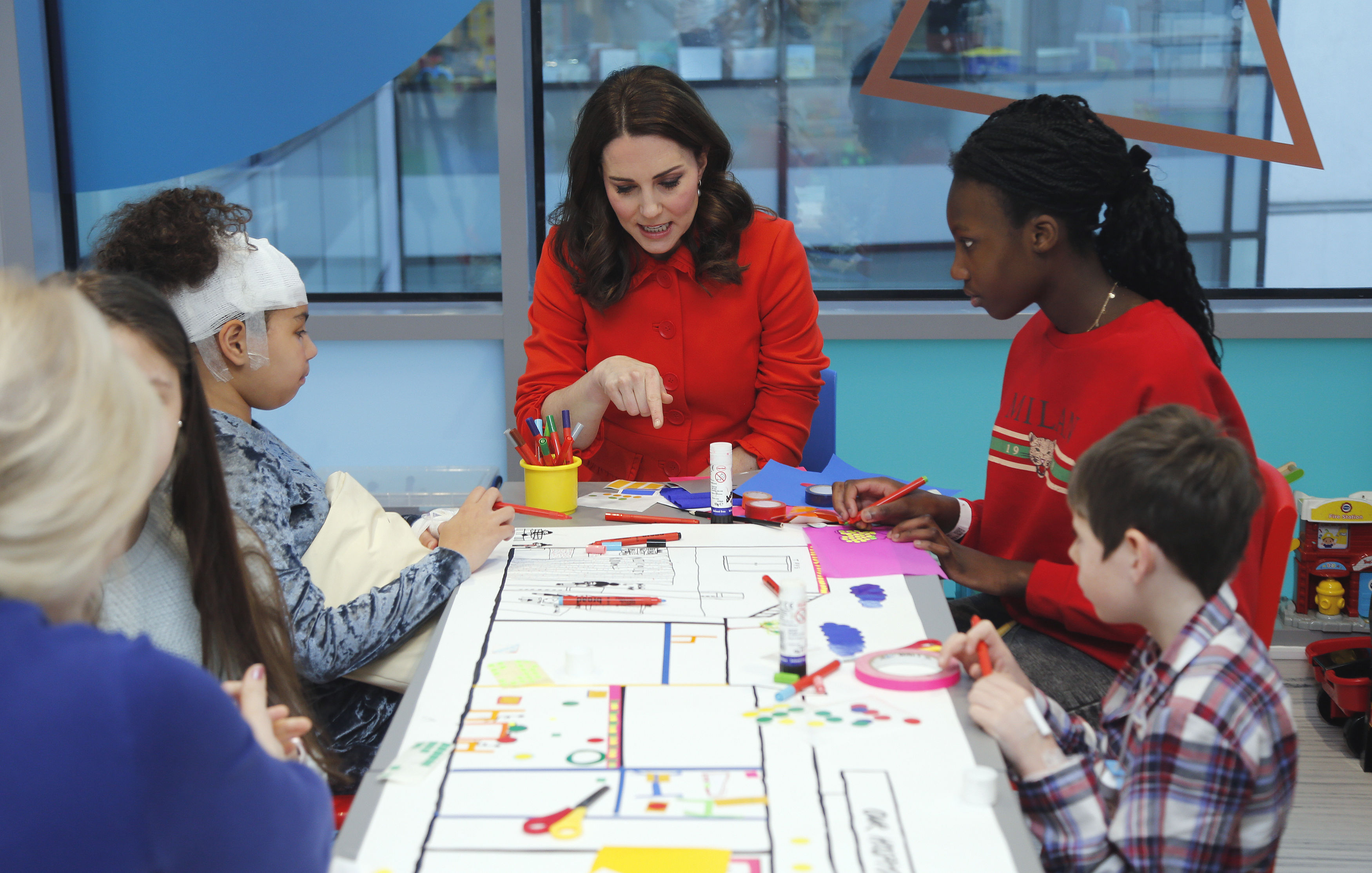 The Duchess of Cambridge speaks to patients as she officially opens the Mittal Children's Medical Centre during a visit to Great Ormond Street Hospital 