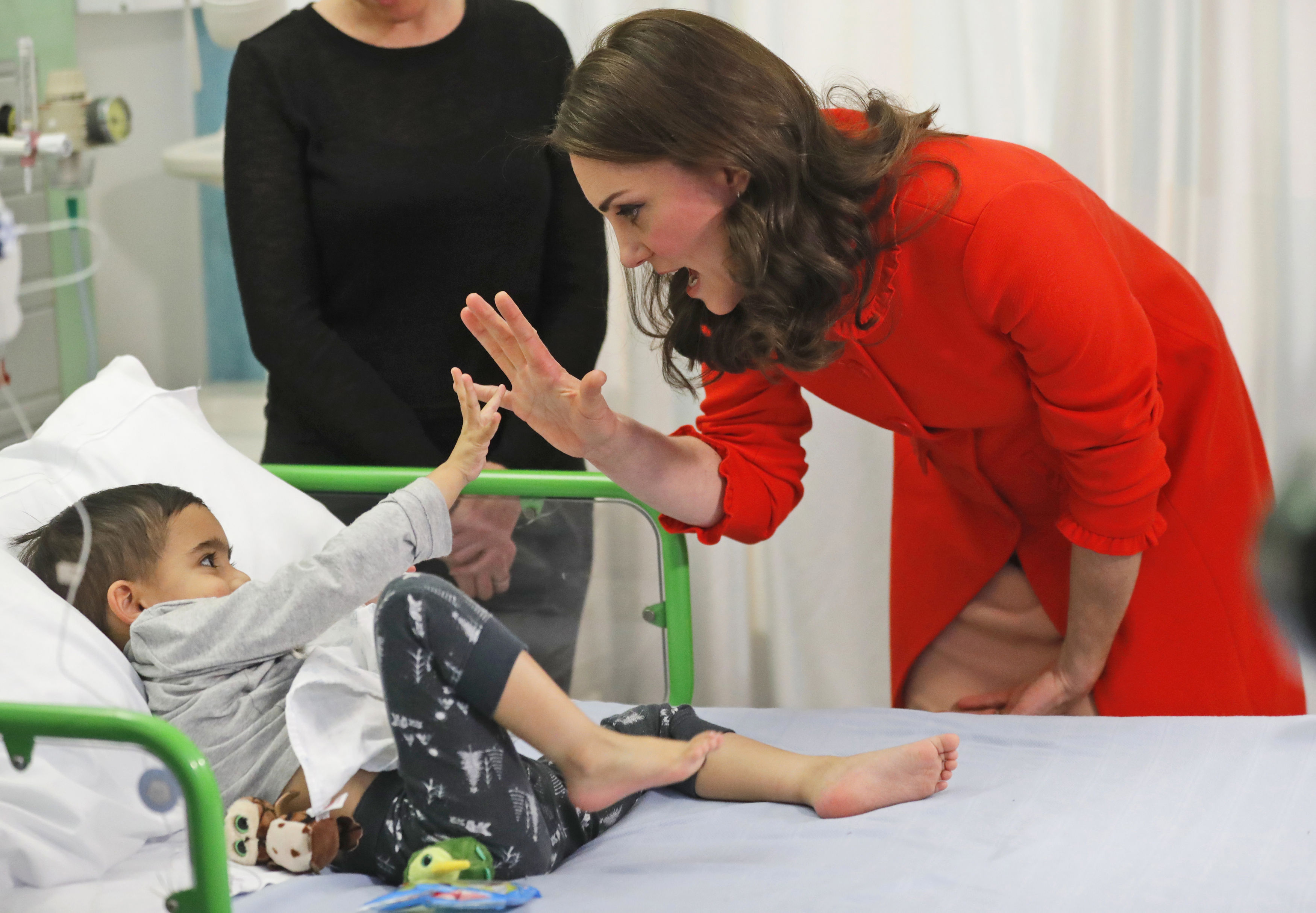 The Duchess of Cambridge with four year old Rafael Chana as she officially opens the Mittal Children's Medical Centre during a visit to Great Ormond Street Hospital