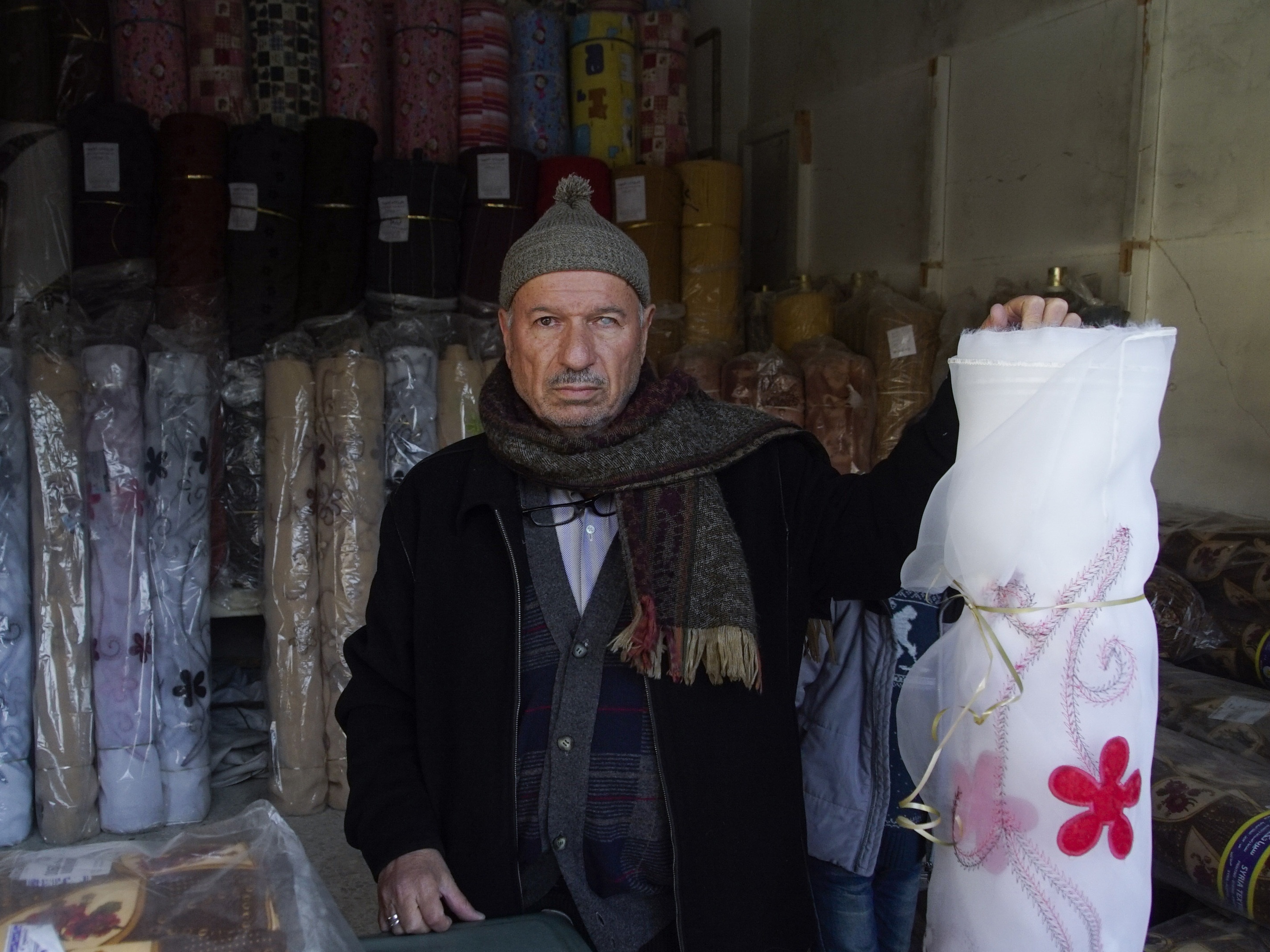 Mahmoud Mimeh, a textile trader in Aleppo's old market Mstyslav Chernov/AP)