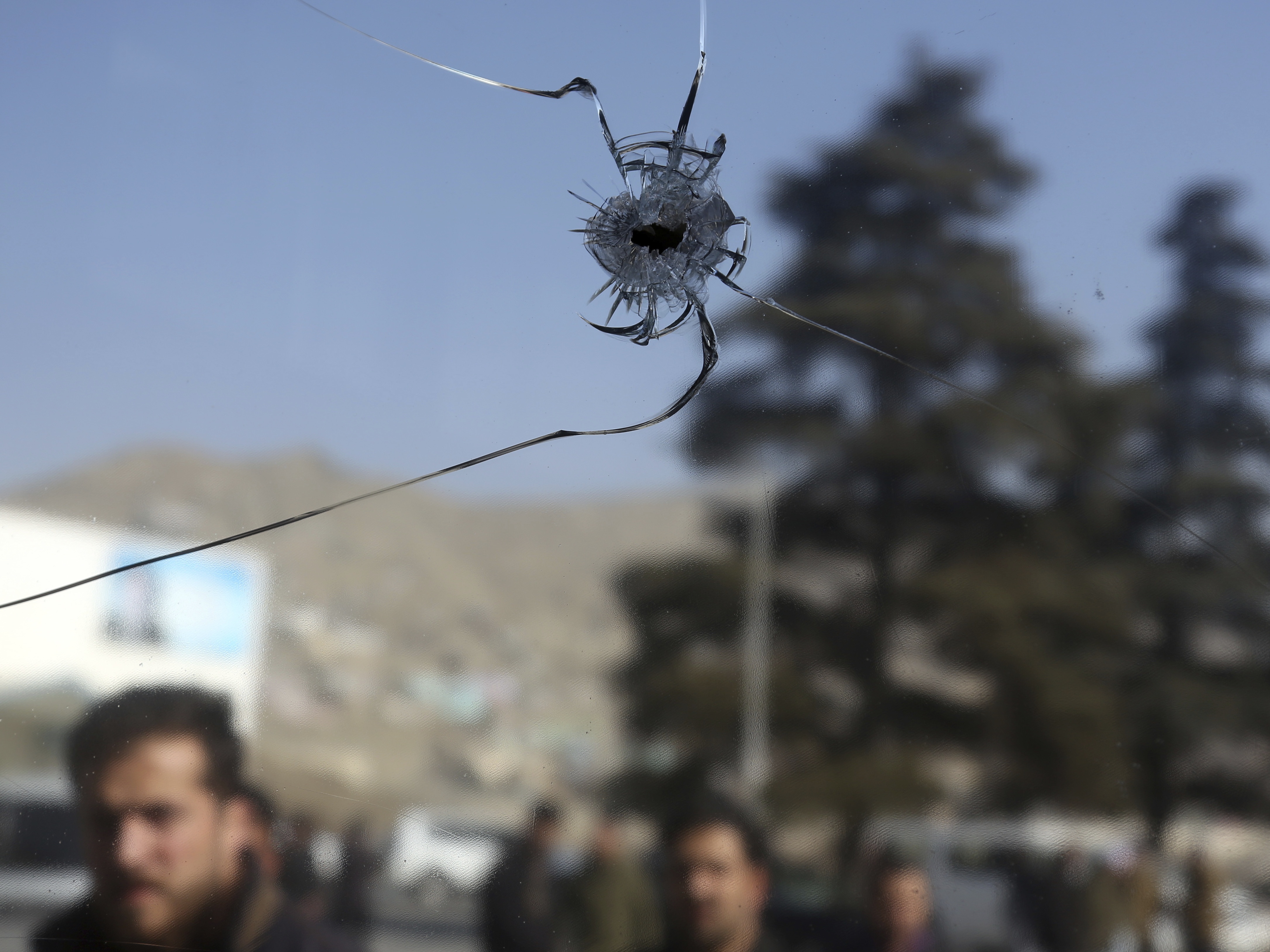 A bullet hole near the scene of the attack (Rahmat Gul/AP)