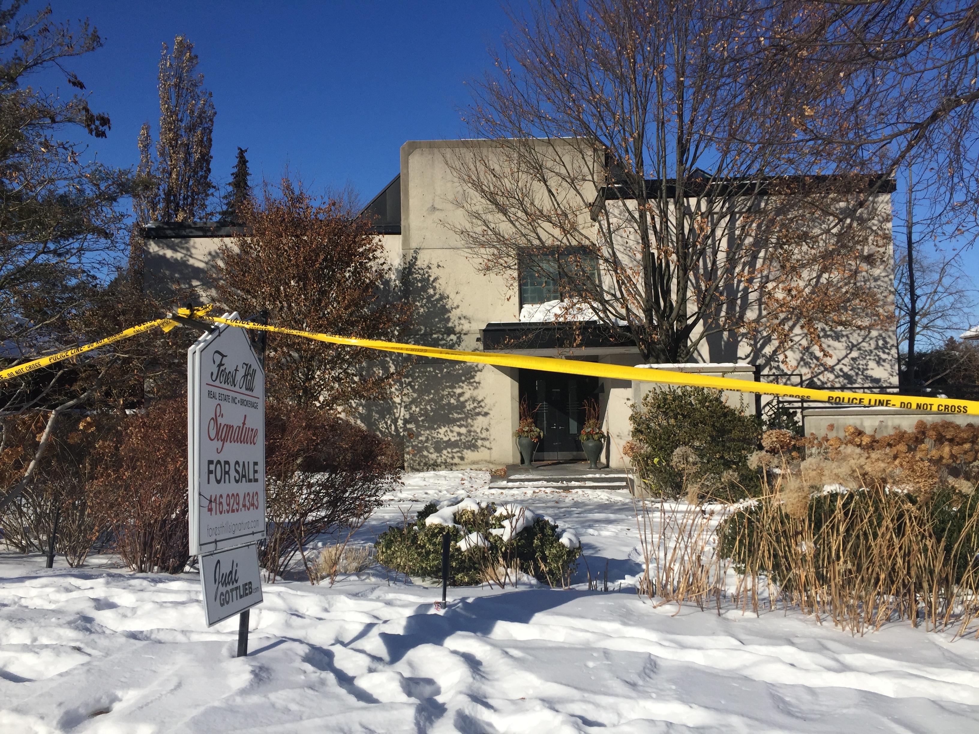 Police crime scene tape marking off the property belonging to Barry and Honey Sherman (Rob Gillies/AP)