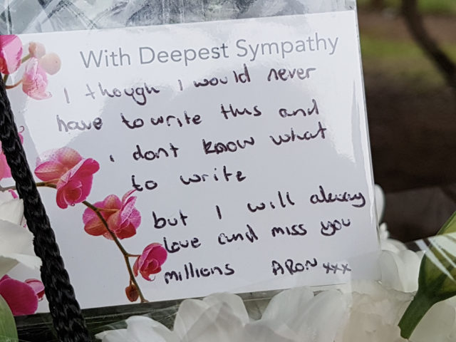 Floral tributes left near the scene in Shepiston Lane in Hayes (Tess De La Mare/PA)