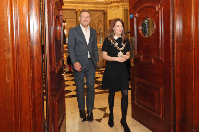 Sir Kenneth Branagh arrives with Belfast Lord Mayor Nuala McAllister at City Hall (Niall Carson/PA)
