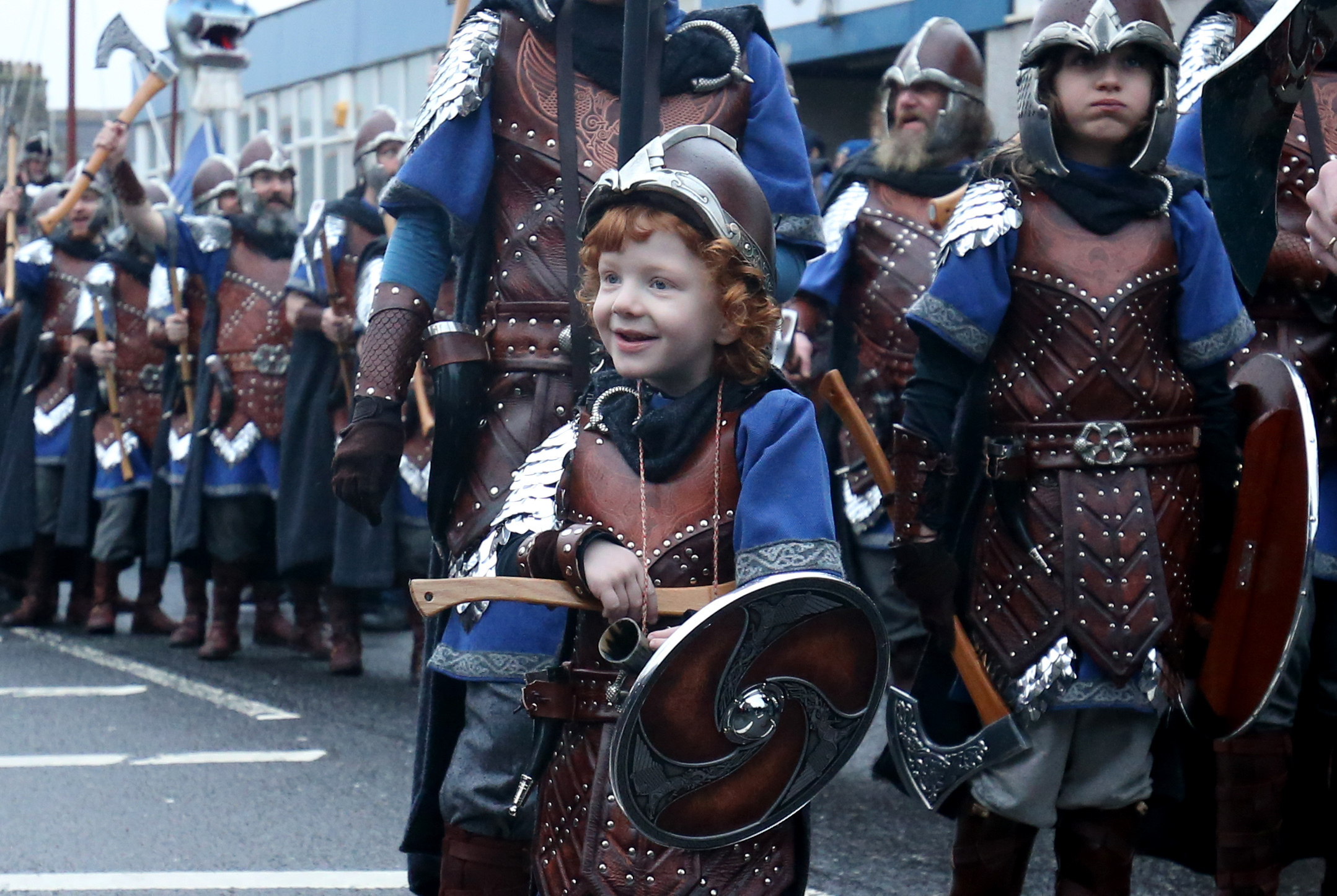 Odin, four, leads his army through the streets of Lerwick (Jane Barlow/PA)