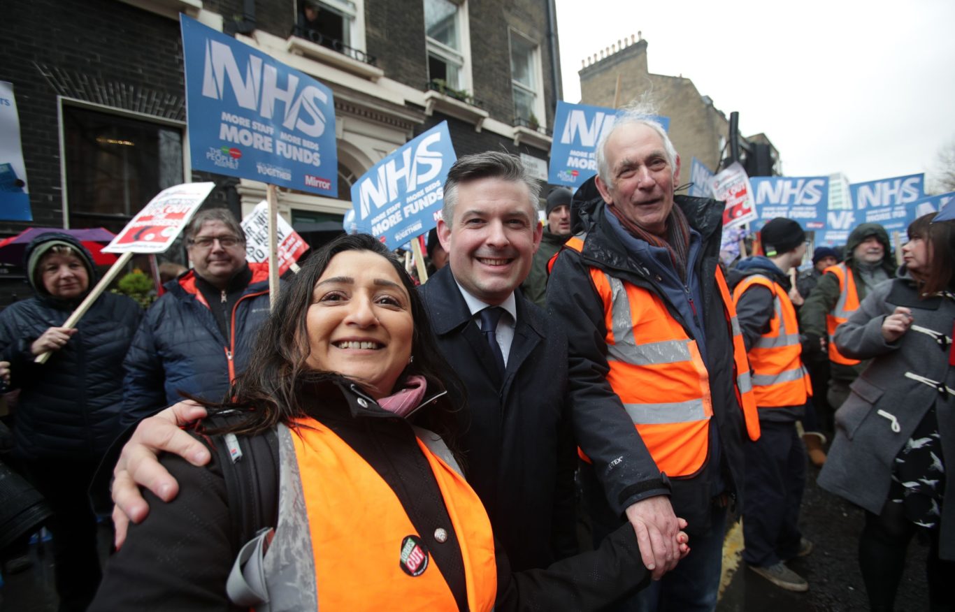 Shadow health Secretary Jon Ashworth MP (centre) joins in (Yui/Mok/PA)