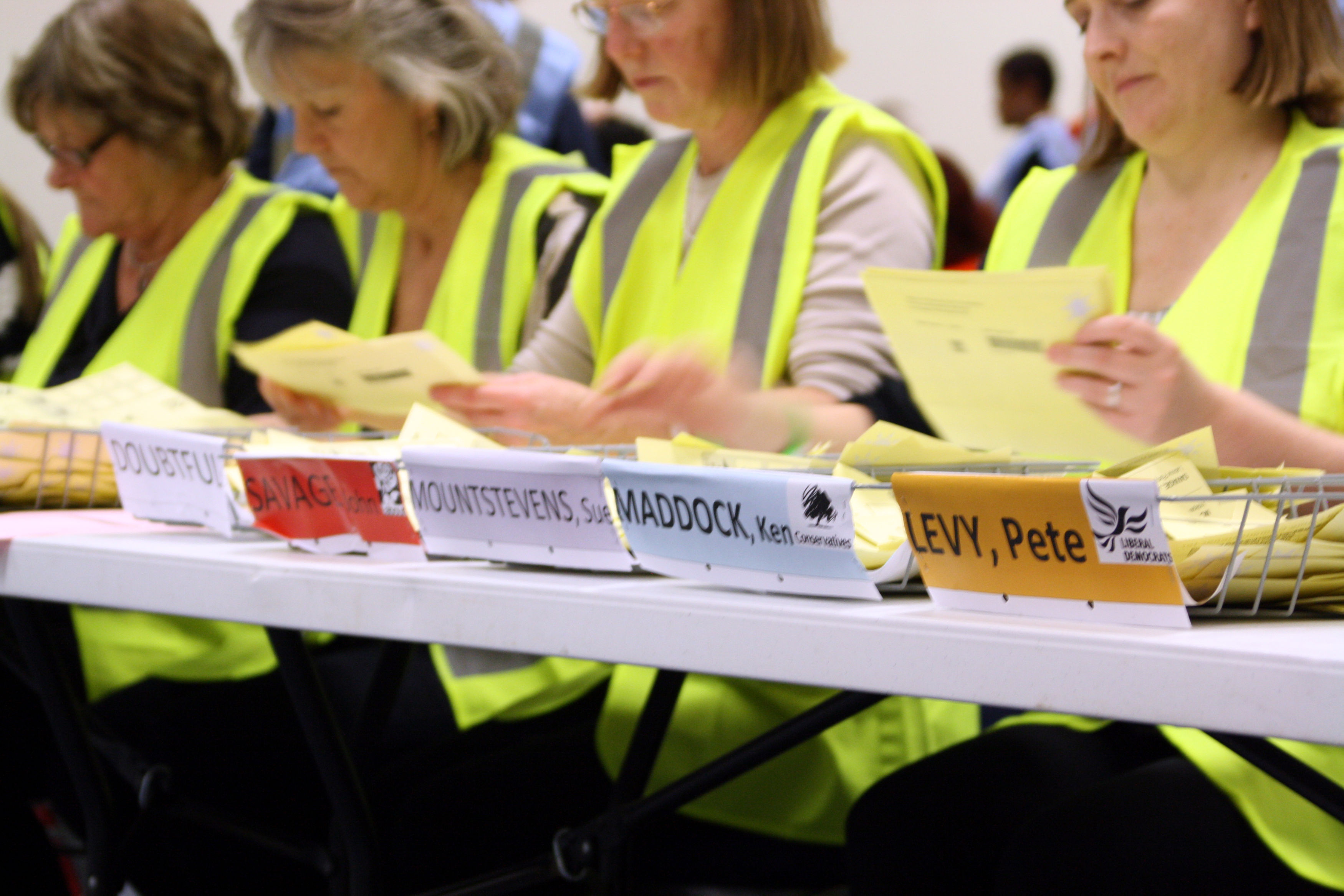 Counting agents sorting ballot papers on election day in 2012