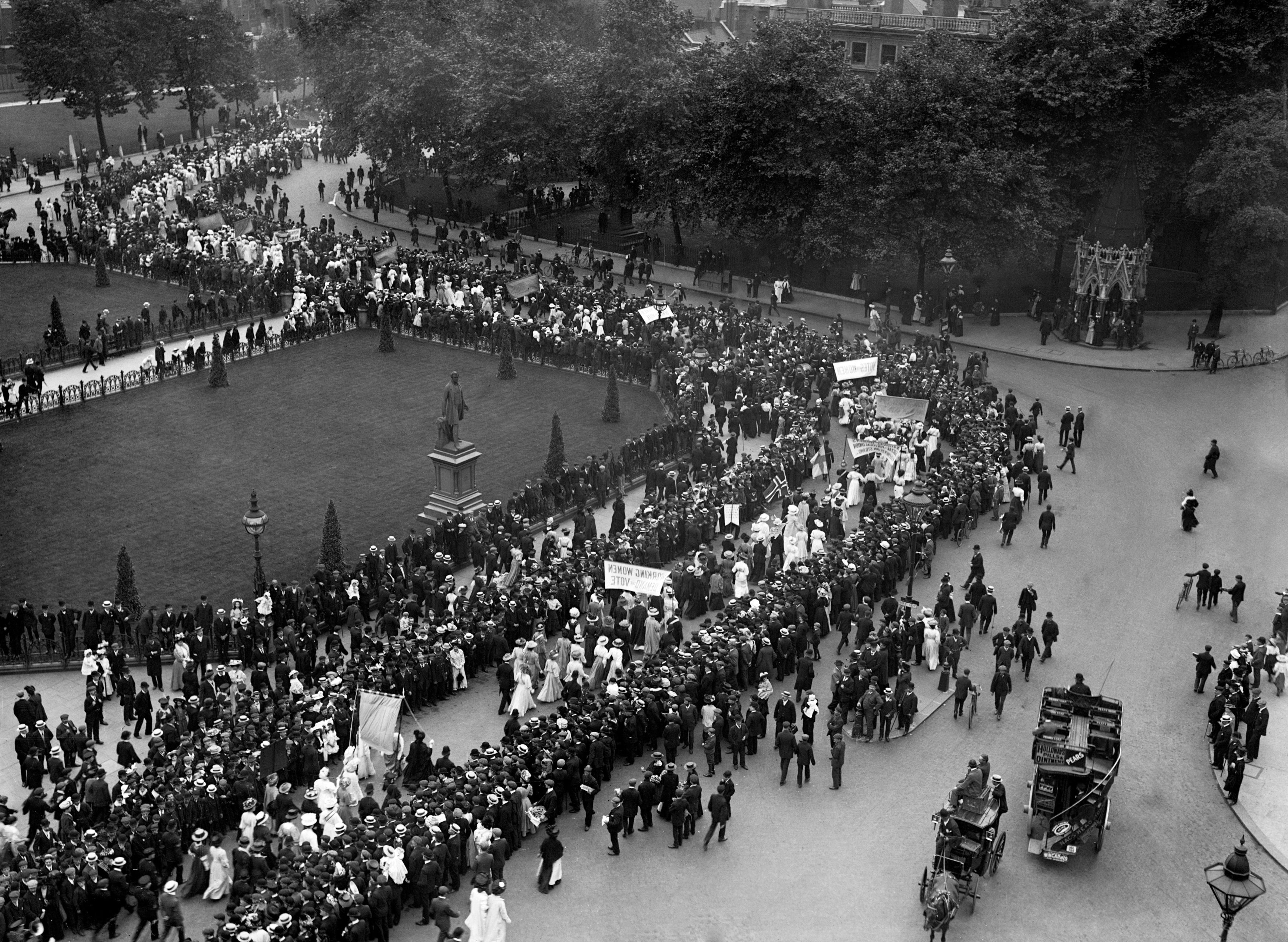 A suffragette procession passing through Parliament Square, London in 1908 (PA)
