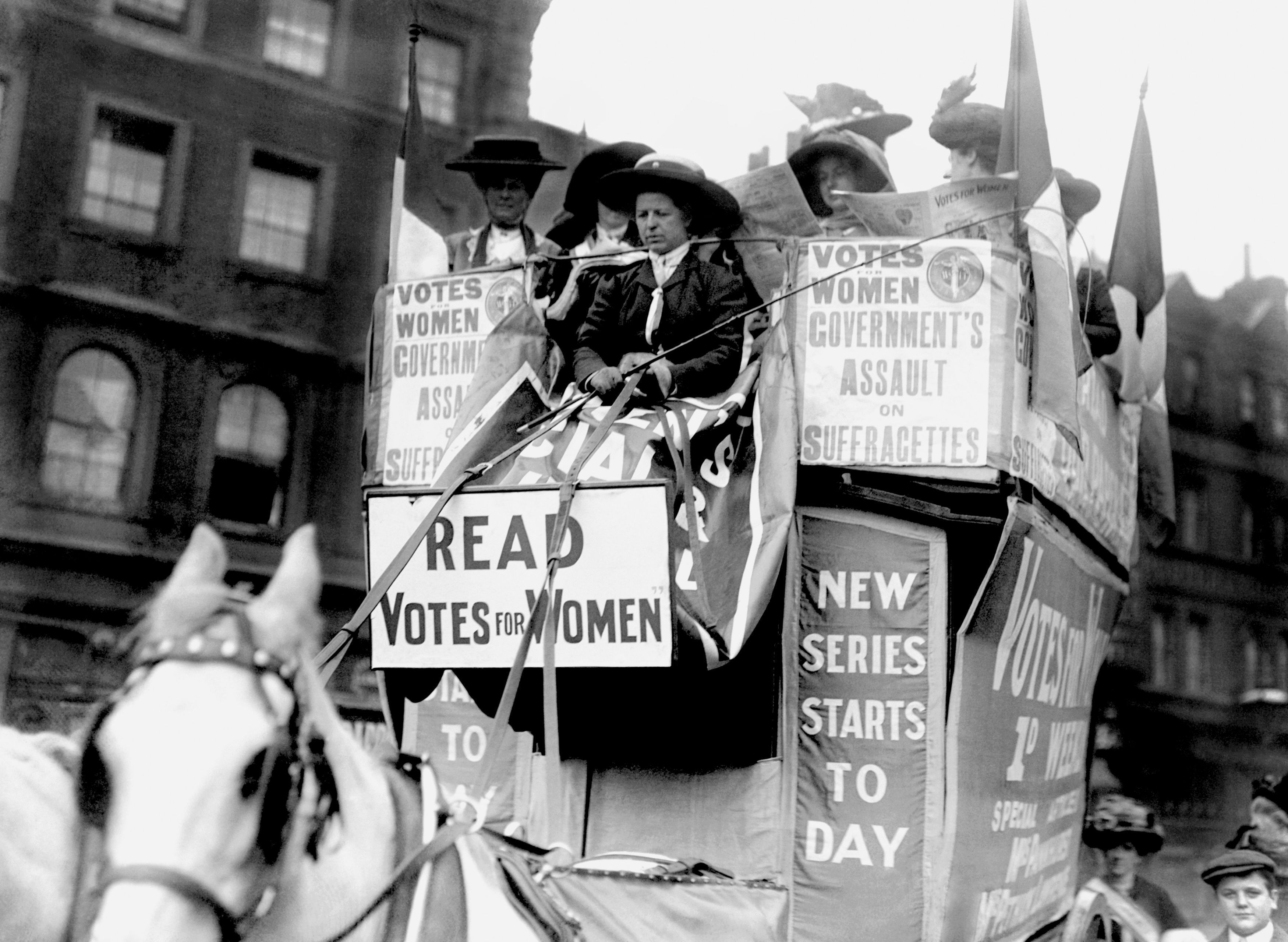 Members of the Women's Social and Political Union (WSPU) on a horse-drawn carriage driven by Emmeline Pankhurst in 1910 (PA)