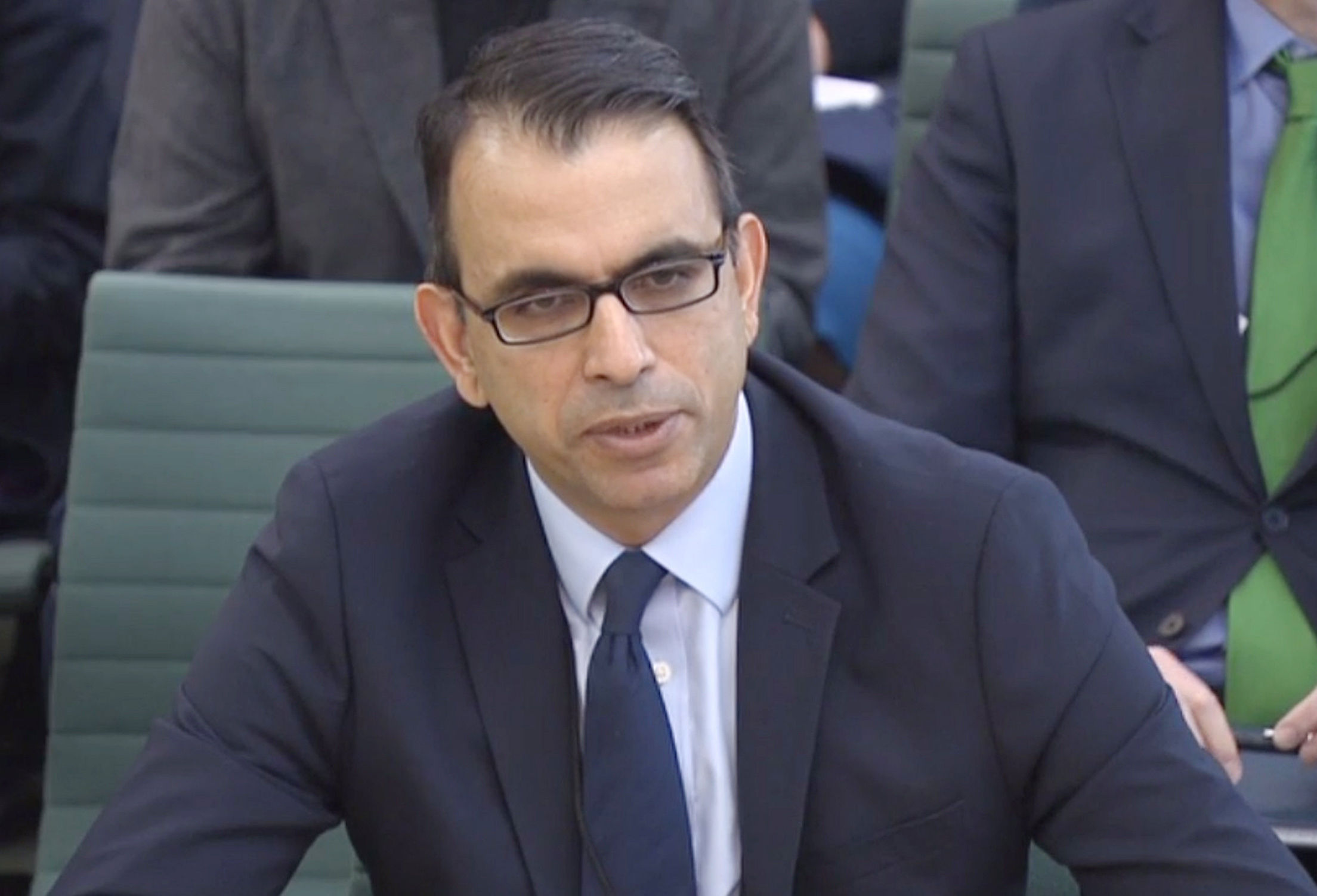 Zafar Khan answering questions at a joint hearing of the Commons Business, Energy and Industrial Strategy Committee and the Work and Pensions Committee at Portcullis House in London