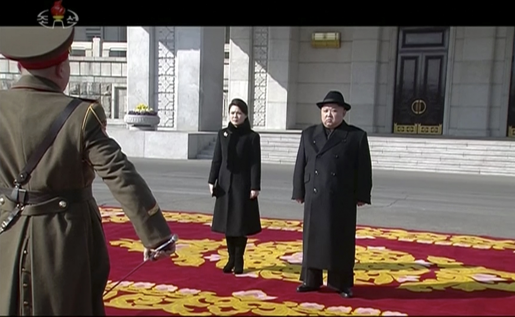 Kim Jong Un and his wife Ri Sol Ju at the parade (KRT via AP)