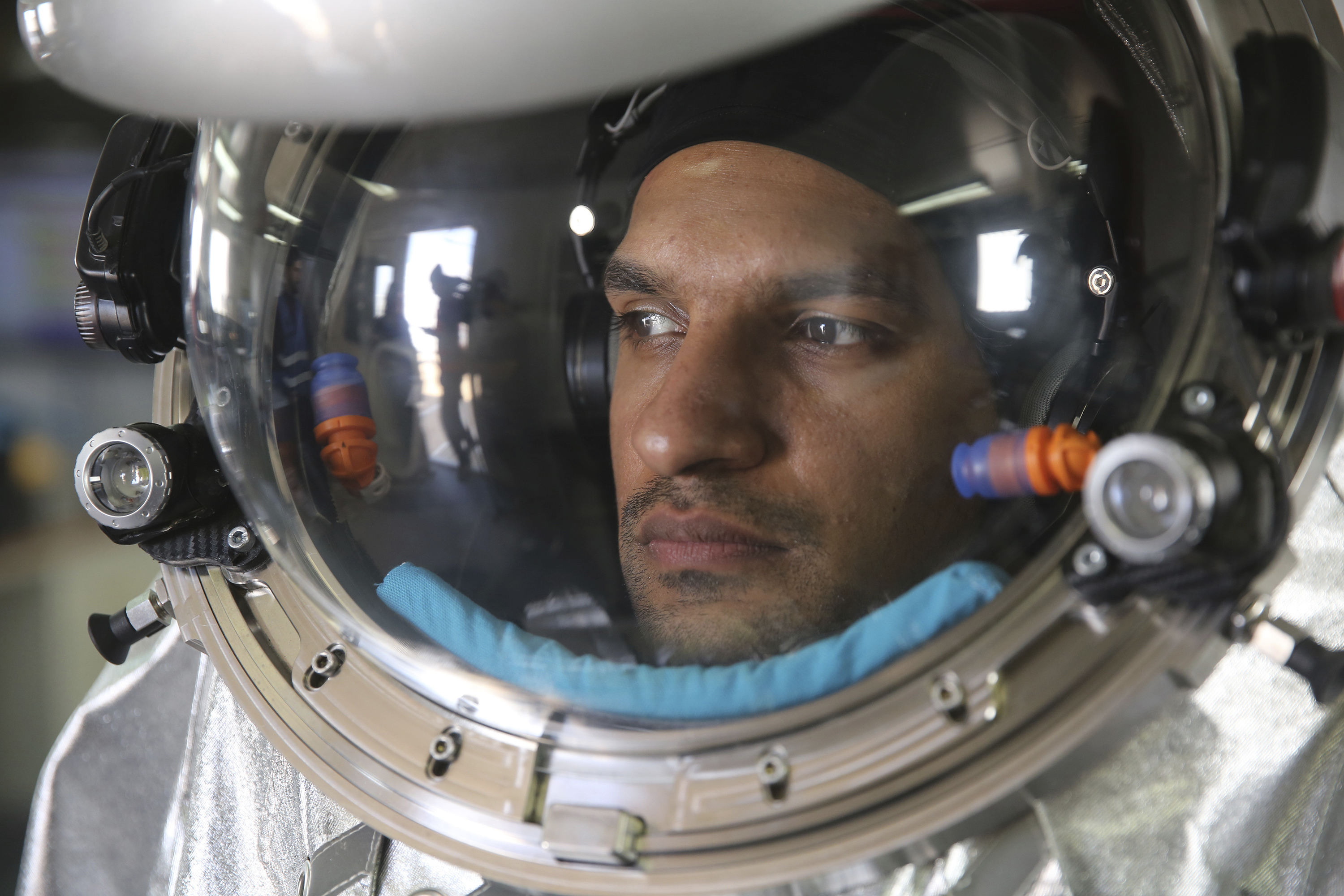 Analogue astronaut Kartik Kumar wearing an experimental space suit during a simulation of a future Mars mission in the Dhofar desert of southern Oman (Sam McNeil/AP)