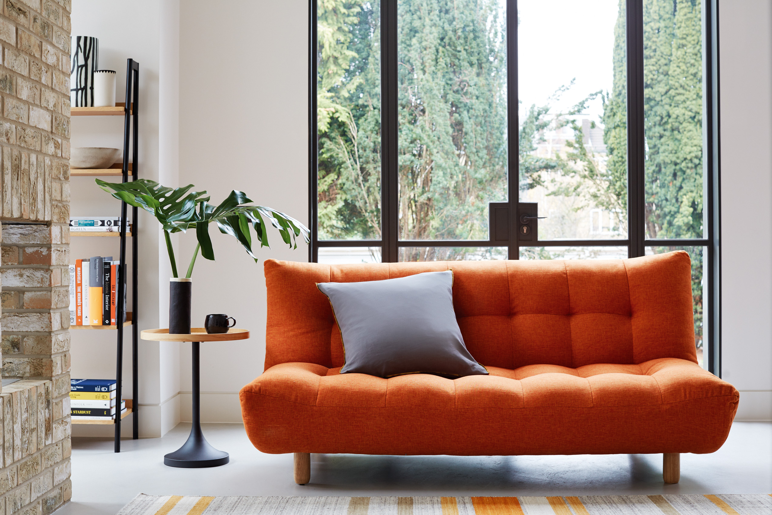 Kota Three Seater Sofa Bed, £395; Bonny Side Table, £80, Habitat (Habitat/Topology/PA)