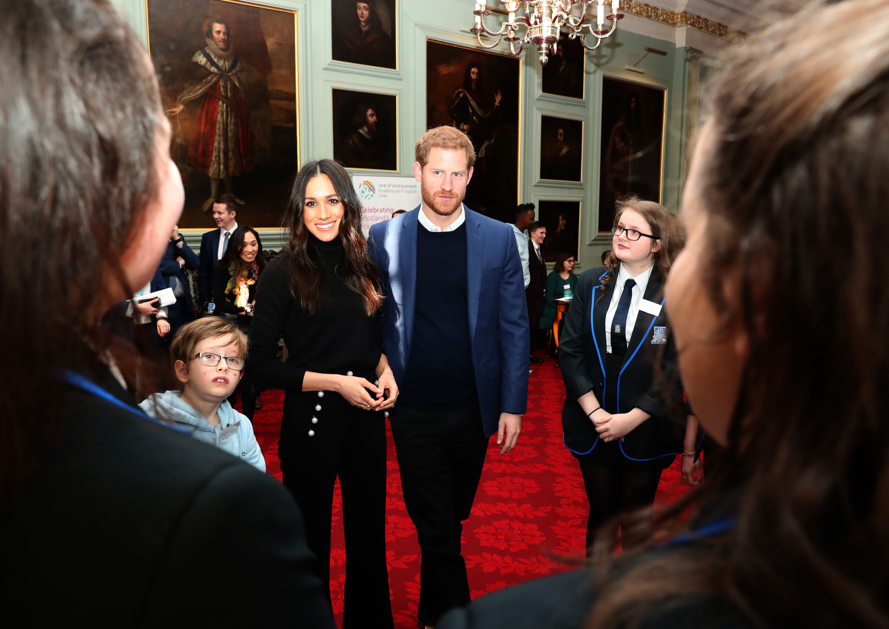 Harry and Ms Markle are the centre of attention at the Palace of Holyroodhouse (Andrew Milligan/PA)
