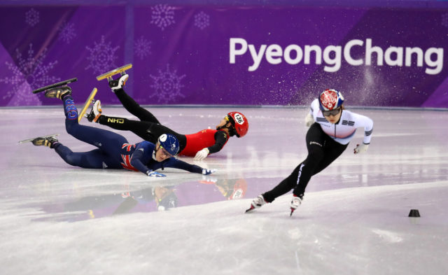 Great Britain's Elise Christie (left) crashes out in the Short Track Speed Skating - Ladies 1,500m Semifinal 3. (Mike Egerton/PA)