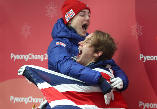 Great Britain's Lizzy Yarnold (right) celebrates winning gold in the Women's Skeleton with bronze medallist Laura Deas. (David Davies/PA)