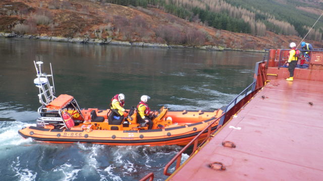 Kyle lifeboat turning the broken down cargo ship (Andrew MacDonald/RNLI/PA)