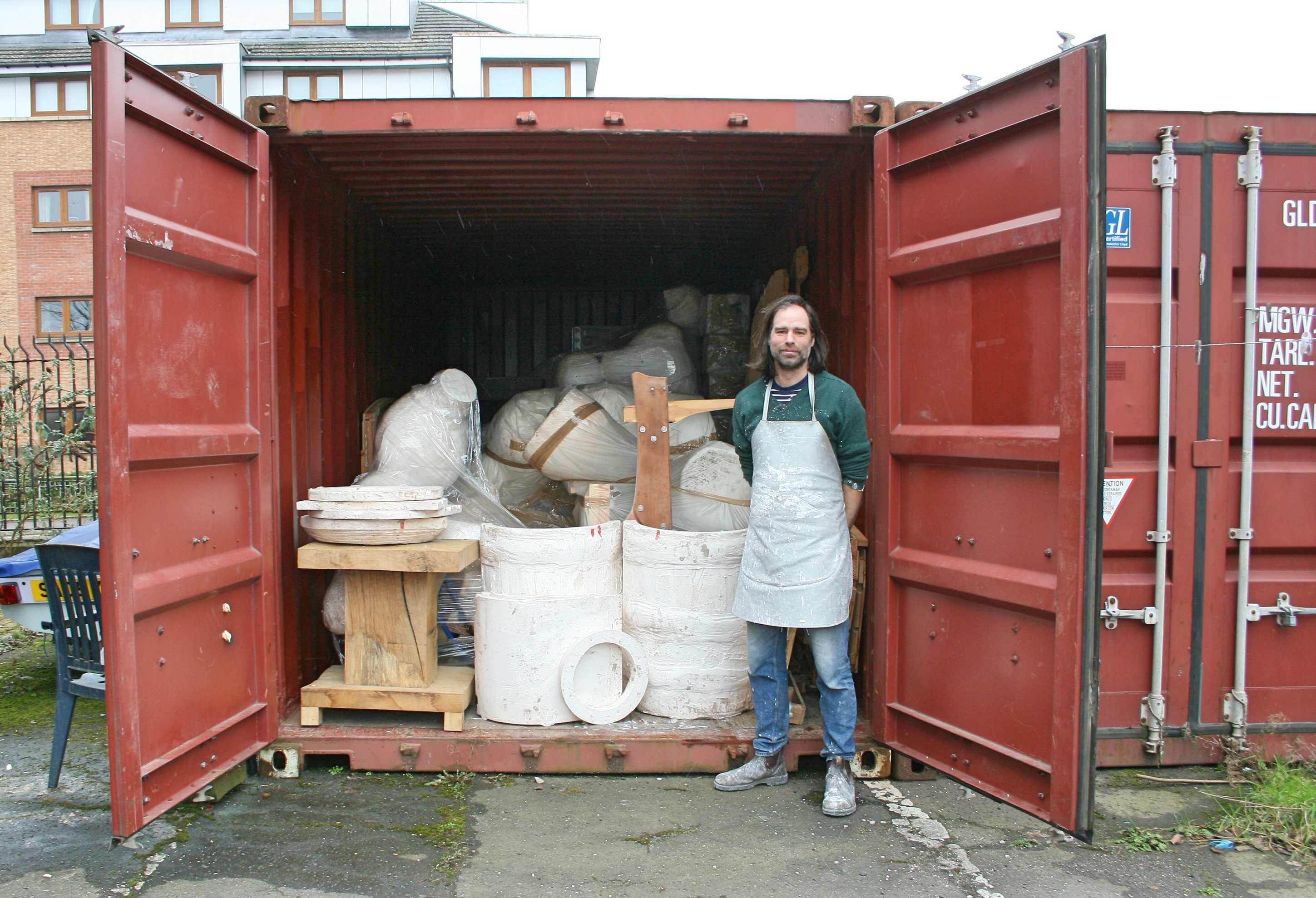 Artist Nick Evans with his stored sculptures in <a href=