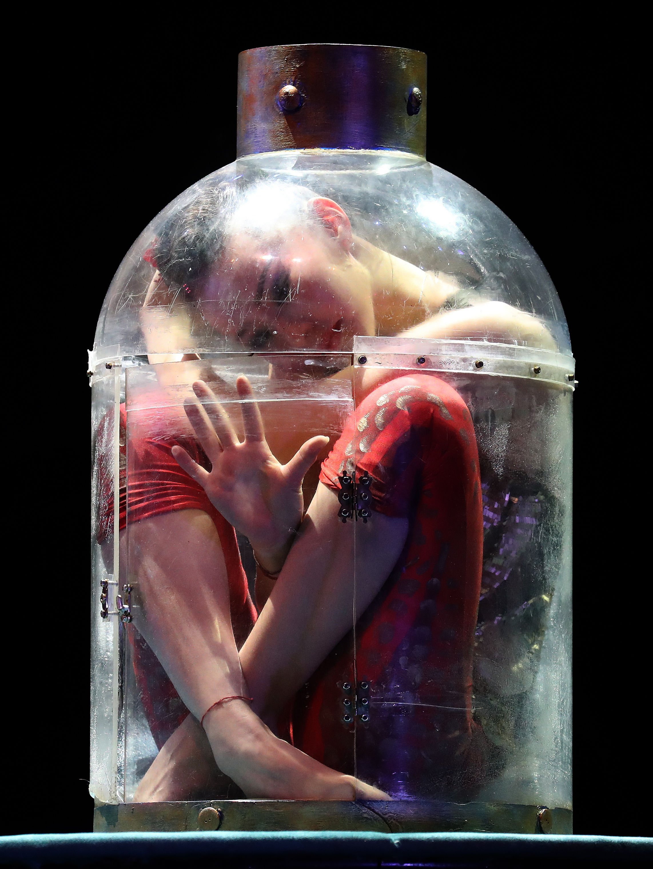 Odka pours herself into a bottle (Andrew Milligan)