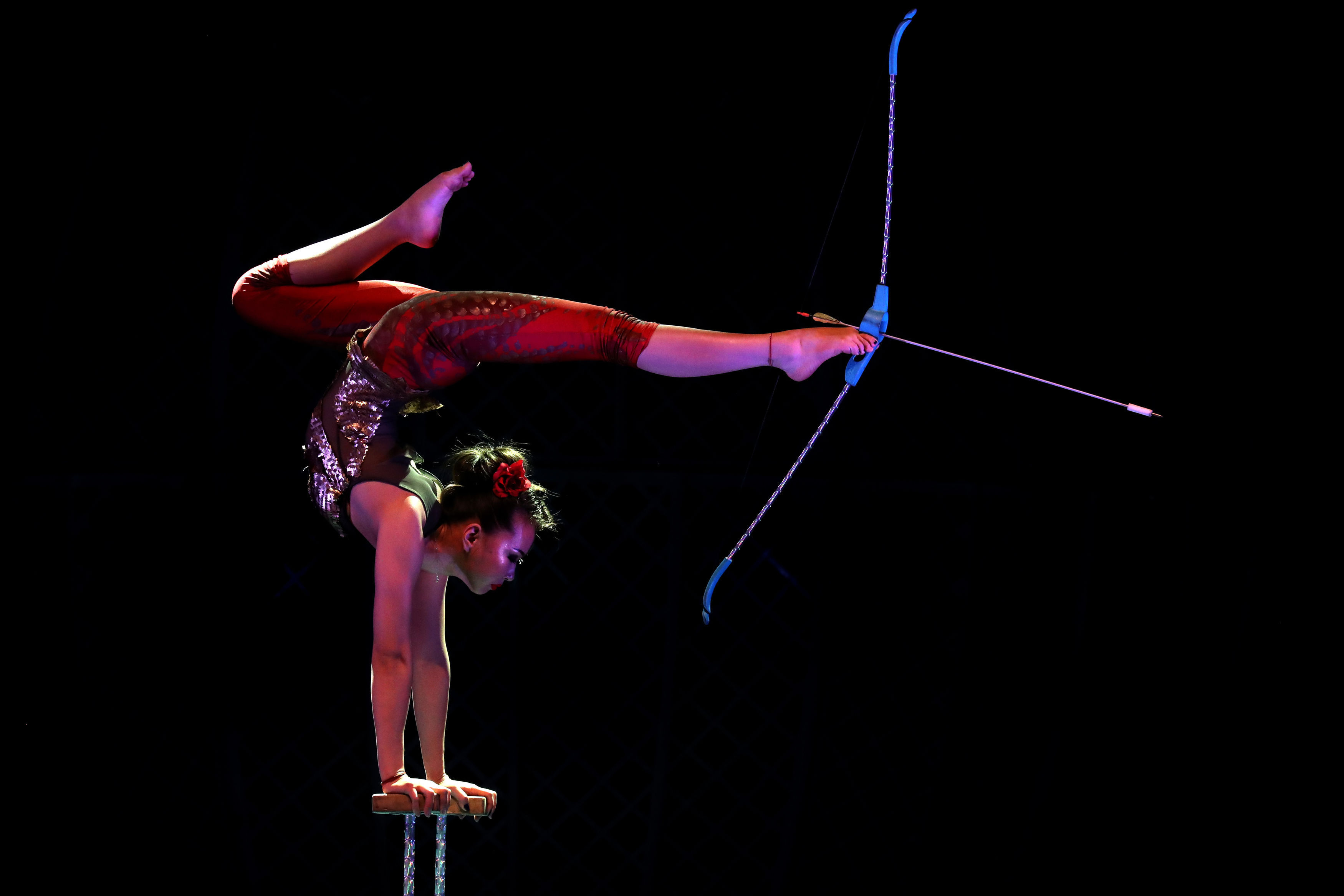 Contortionist Odka prepares to use a bow and arrow (Andrew Milligan/PA)