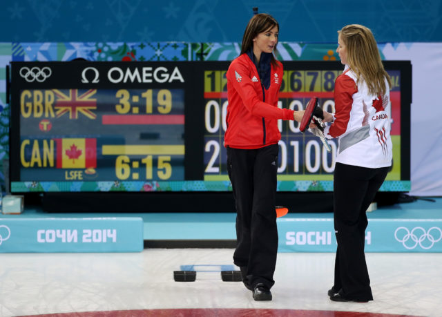 So close to a chance of gold as Muirhead congratulates Canada skip Jennifer Jones following a 6-4 defeat in the Sochi semi-final