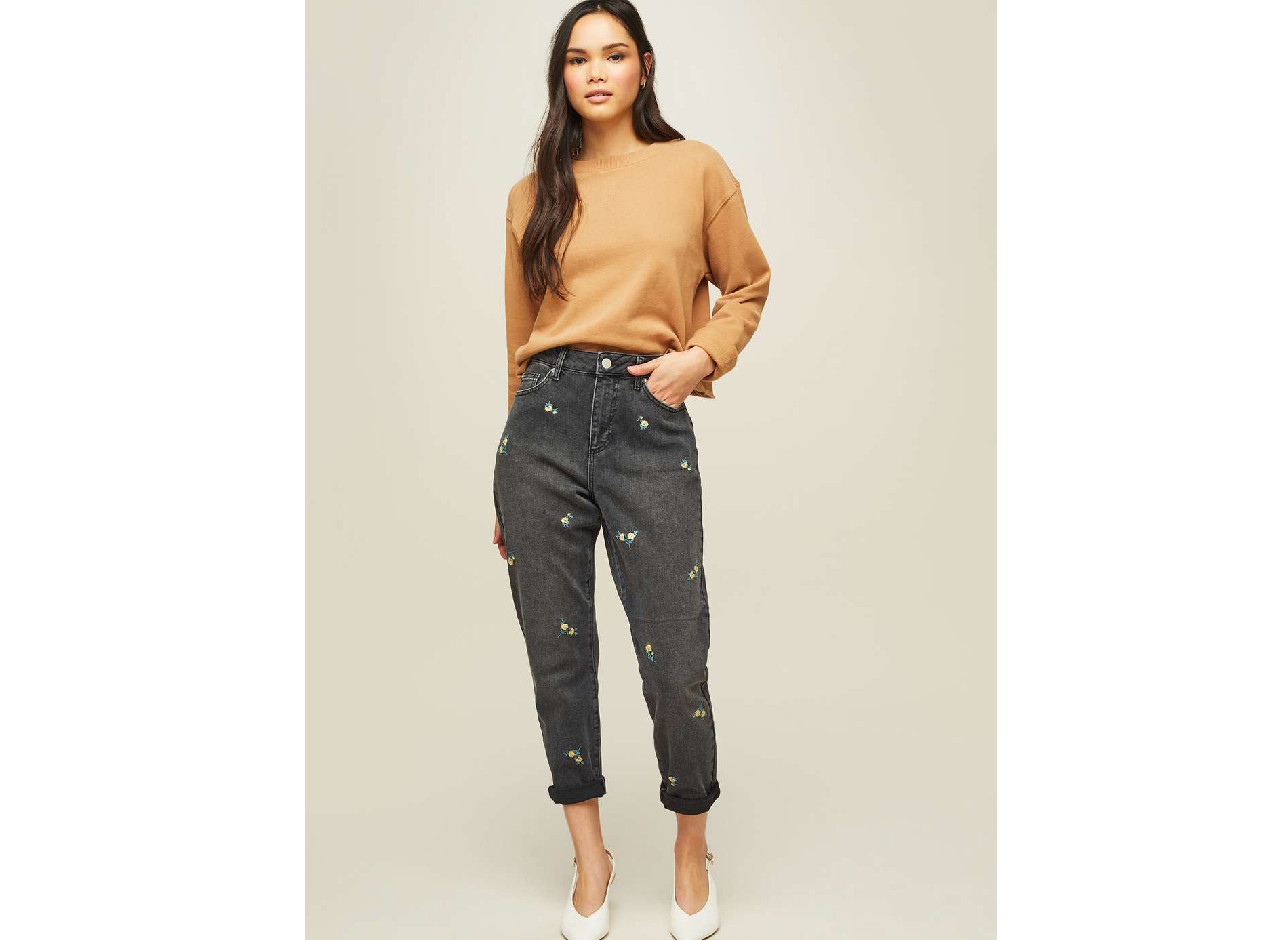 model wearing Miss Selfridge Camel Cropped Sweatshirt and Mom Black Ditsy Embroidered Jeans
